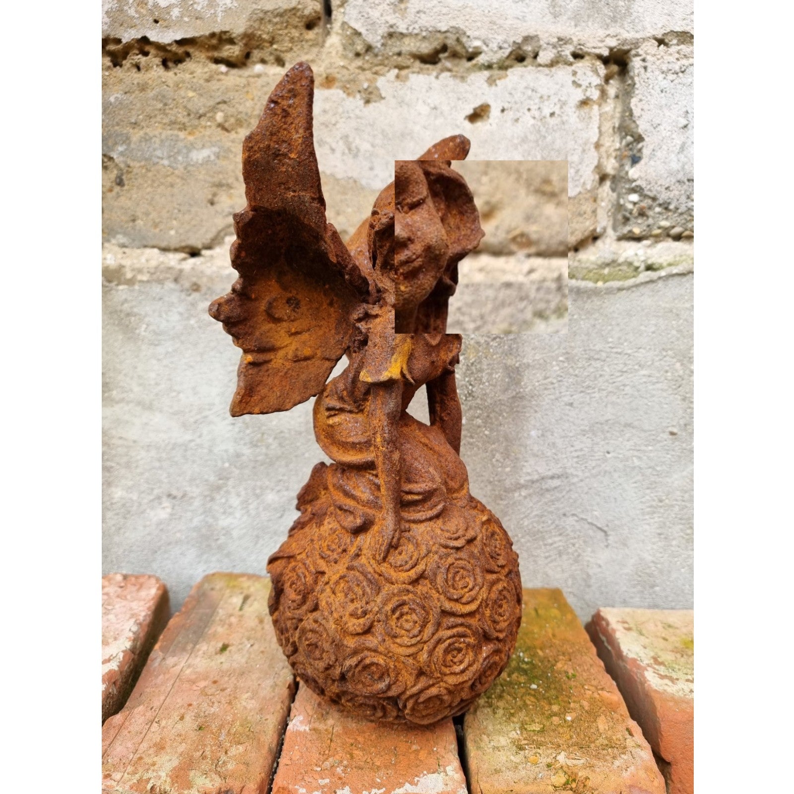 Rusty Cast Iron Figurine of a Fairy on Ball. Garden Yard Sculptures