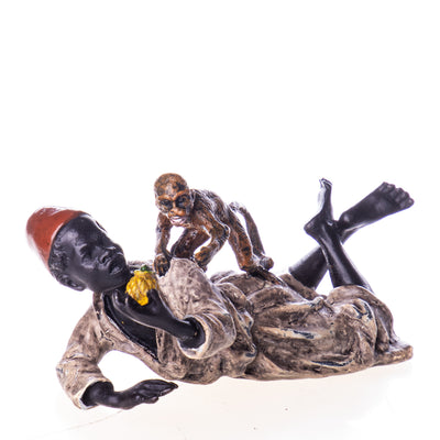 Colored bronze figure boy with monkeys | Handcrafted Bronze Decor