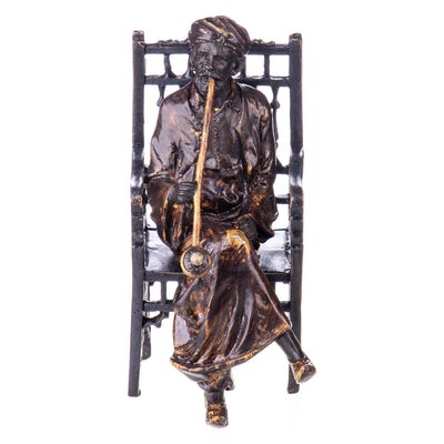 Colored bronze figure of Viennese style Arab on chair with whistle