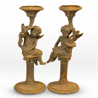 Pair of Rusty Cast Iron Putti Candlestands | Curios & Collectibles
