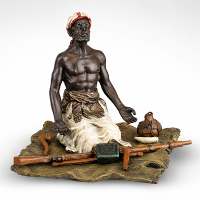 Seated Arms Dealer | Handcrafted Bronze Decor | Unique Home Accent