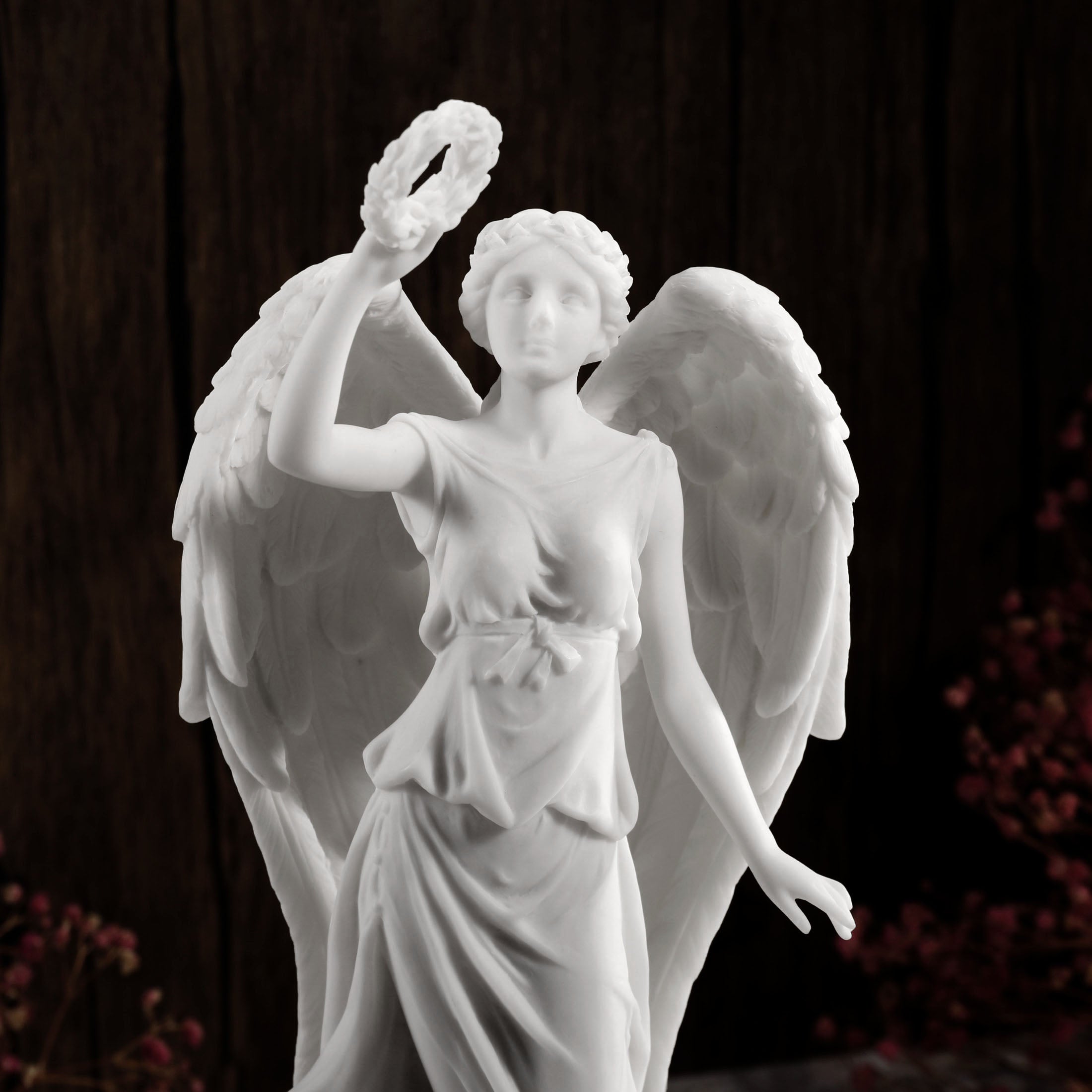 Angel Holding Wreath Standing On Earth