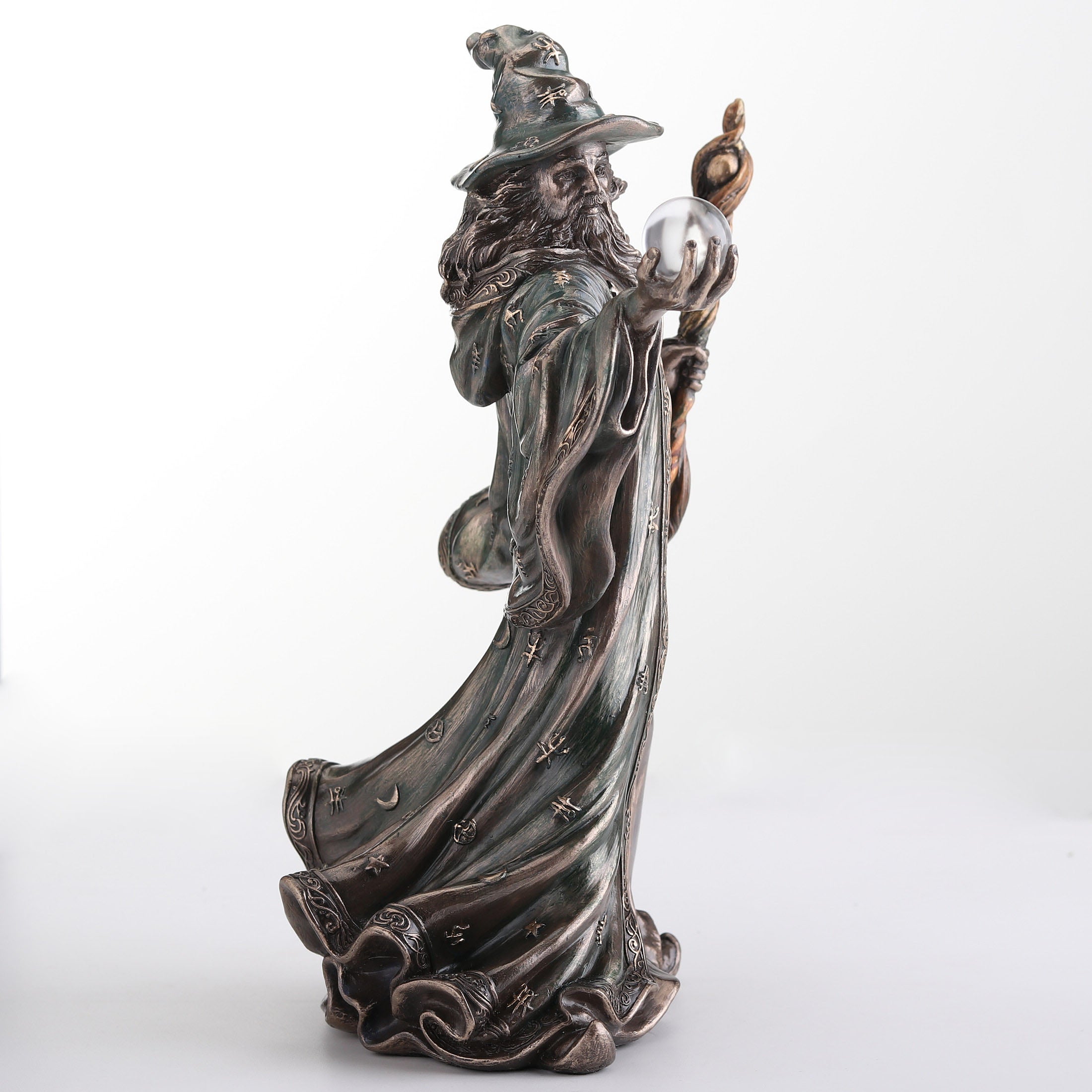 Wizard Holding Crystal Ball And Staff