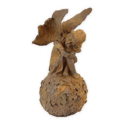 Rusty Cast Iron Figurine of a Fairy on Ball. Home Decor