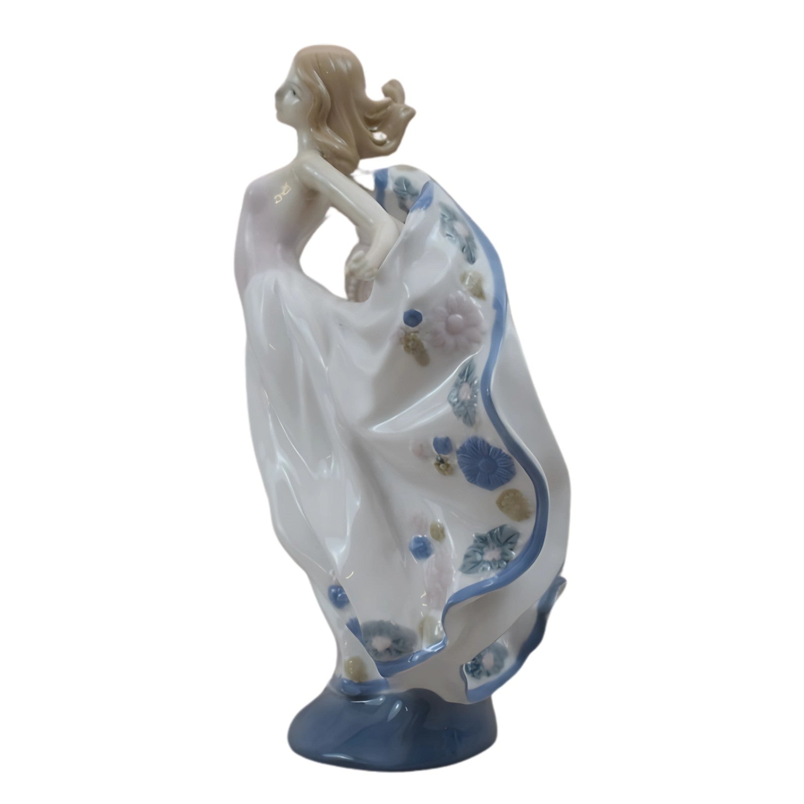 Porcelain Figurine of a Graceful Dancer in Flowing Floral Dress