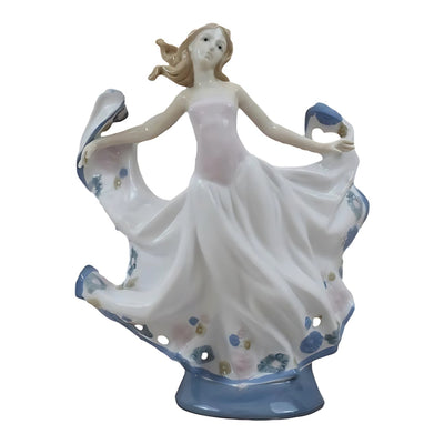 Porcelain Figurine of a Graceful Dancer in Flowing Floral Dress