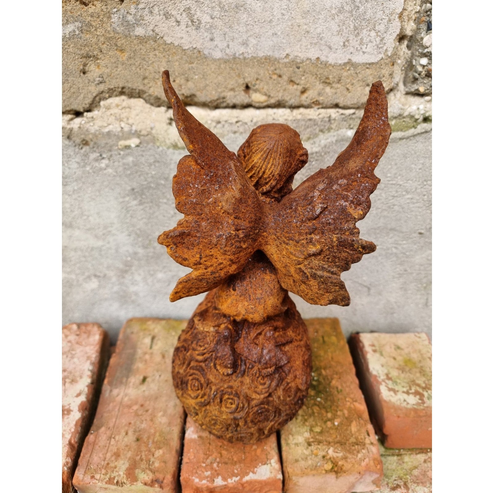 Rusty Cast Iron Figurine of a Fairy on Ball. Garden Yard Sculptures