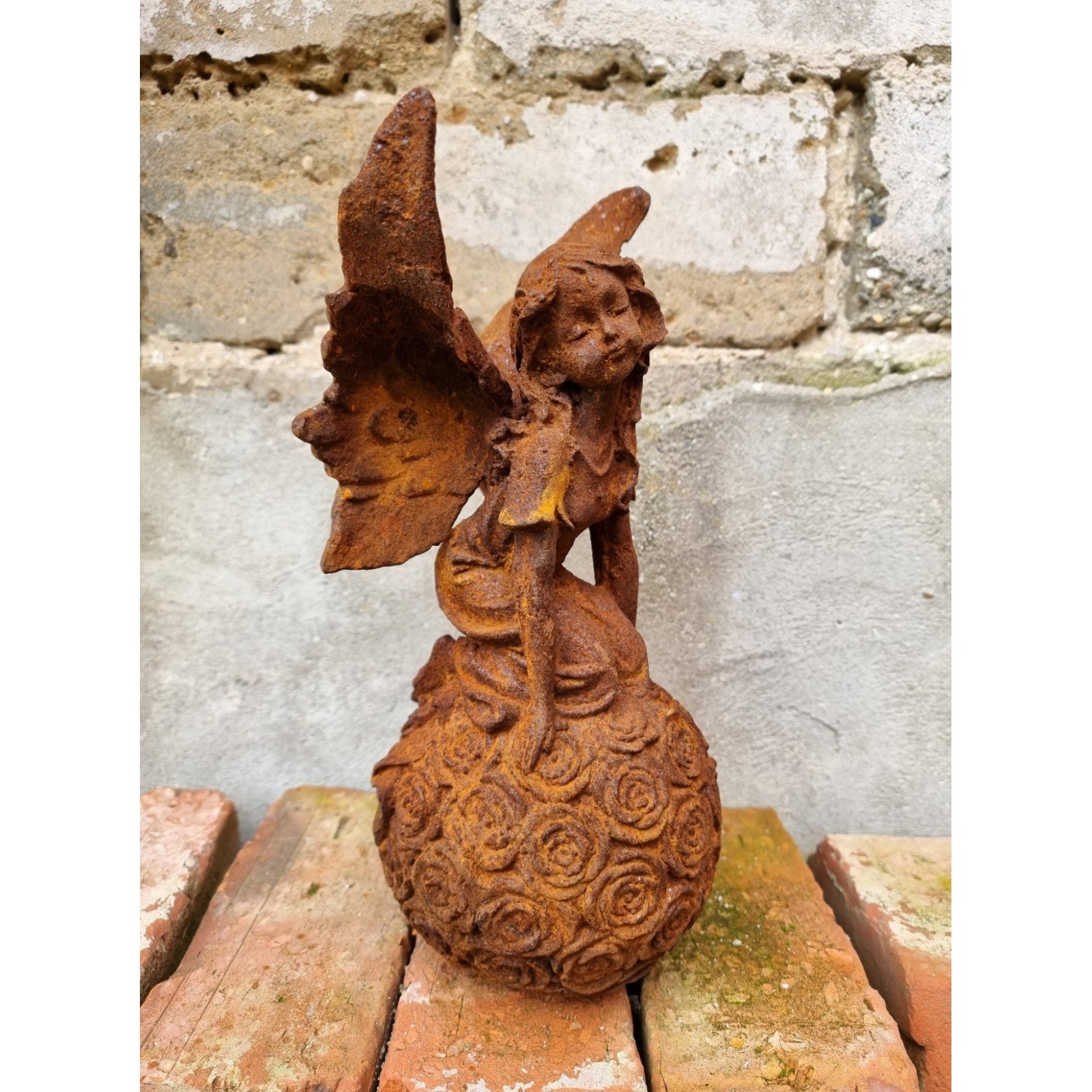 Rusty Cast Iron Figurine of a Fairy on Ball. Garden Yard Sculptures