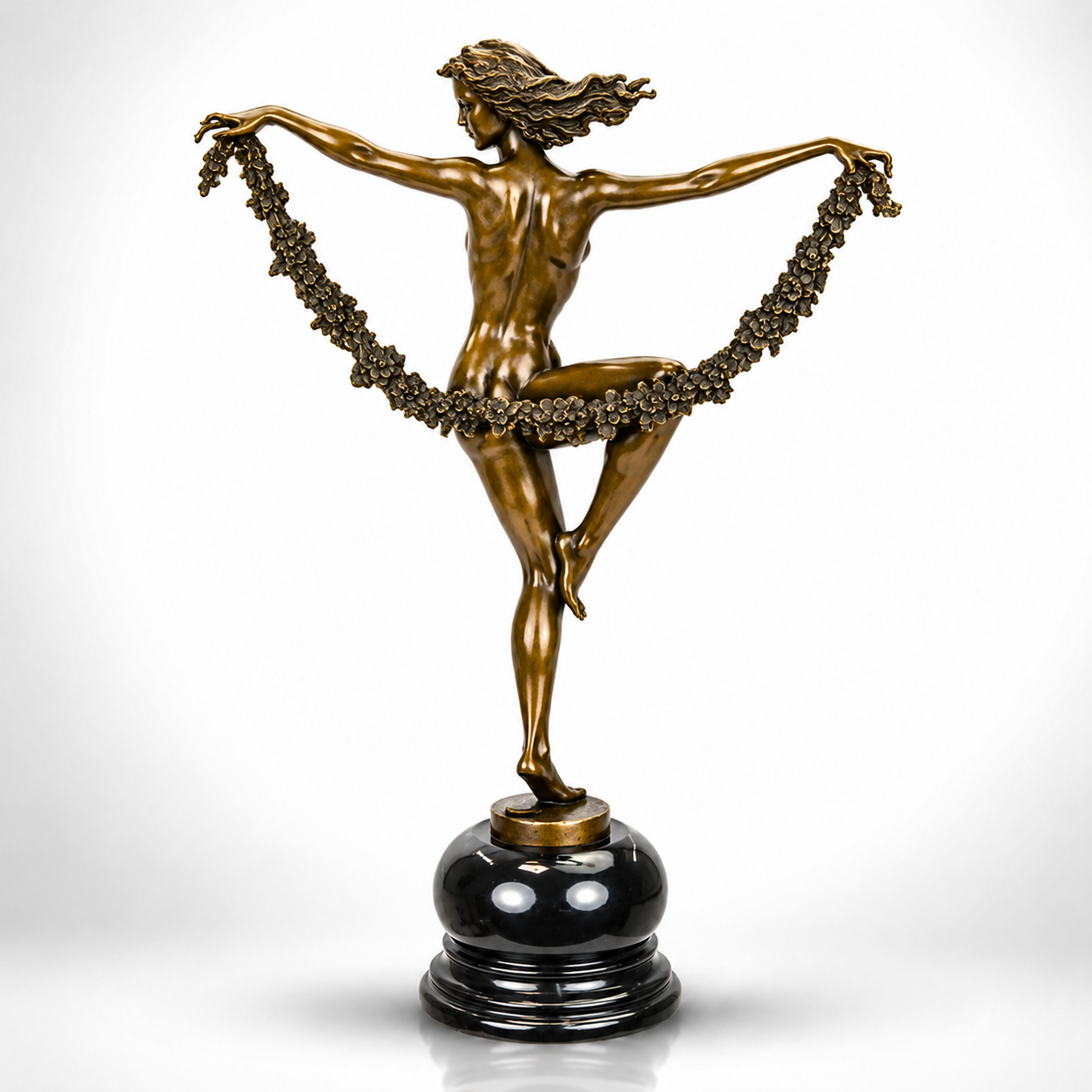 Bronze Sculpture of a Graceful Dancer with Floral Garland