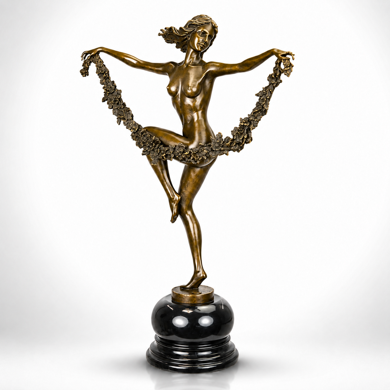Bronze Sculpture of a Graceful Dancer with Floral Garland