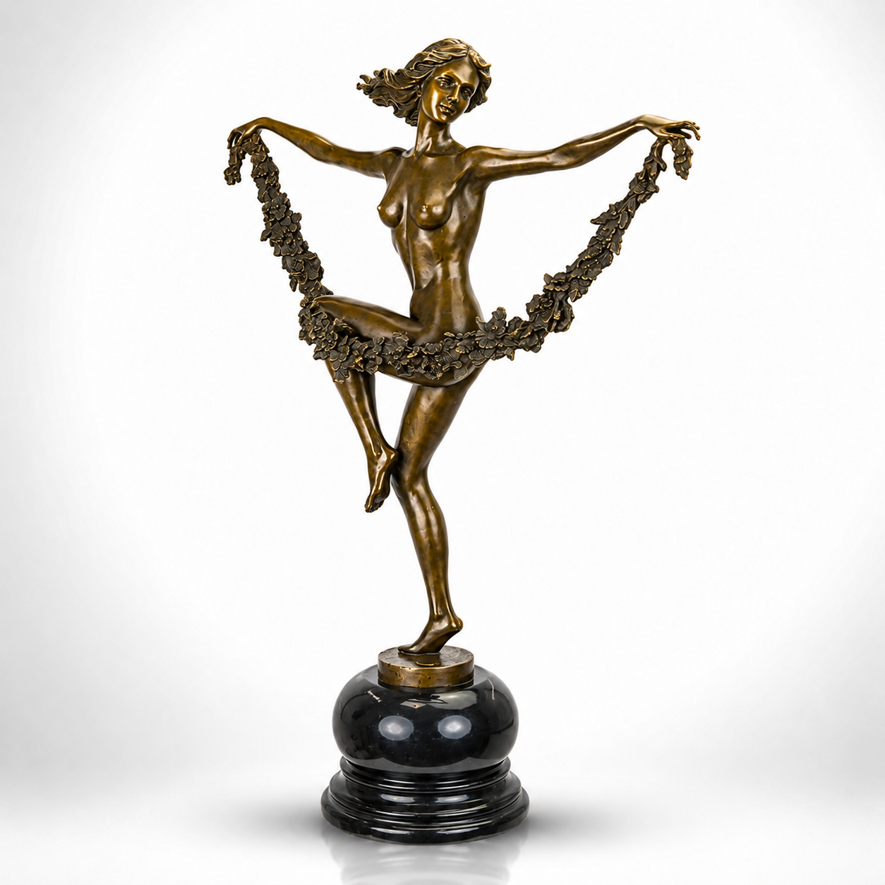 Bronze Sculpture of a Graceful Dancer with Floral Garland