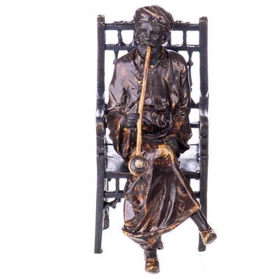 Colored bronze figure of Viennese style Arab on chair with whistle