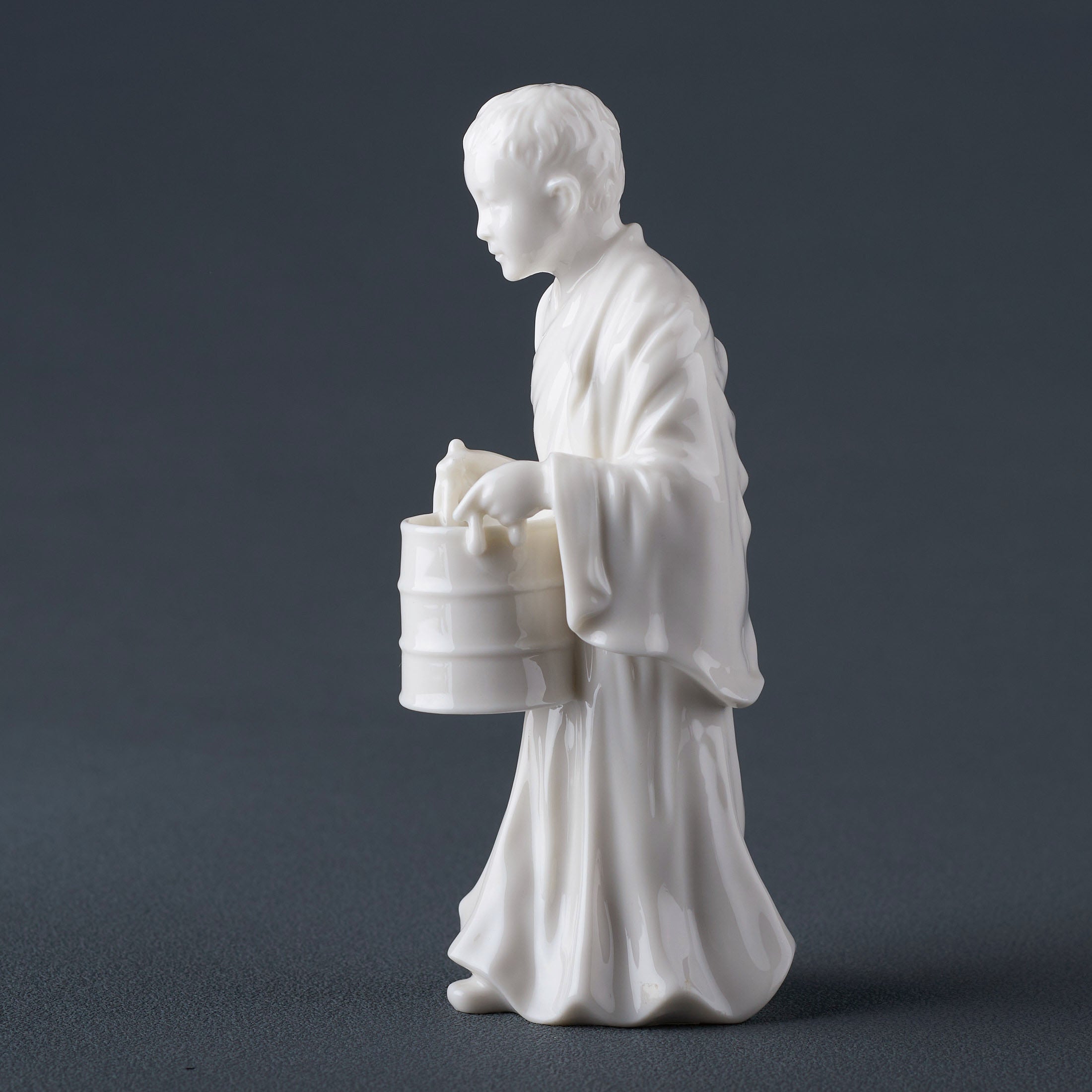 Tibet FigurineYoung Lama Holding A Bucket