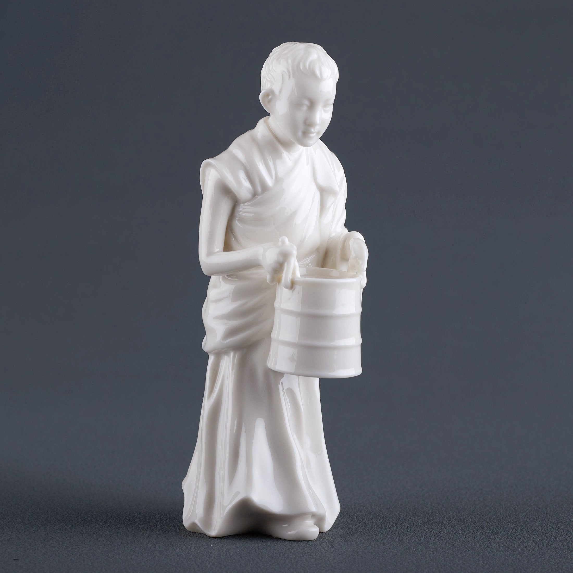 Tibet FigurineYoung Lama Holding A Bucket
