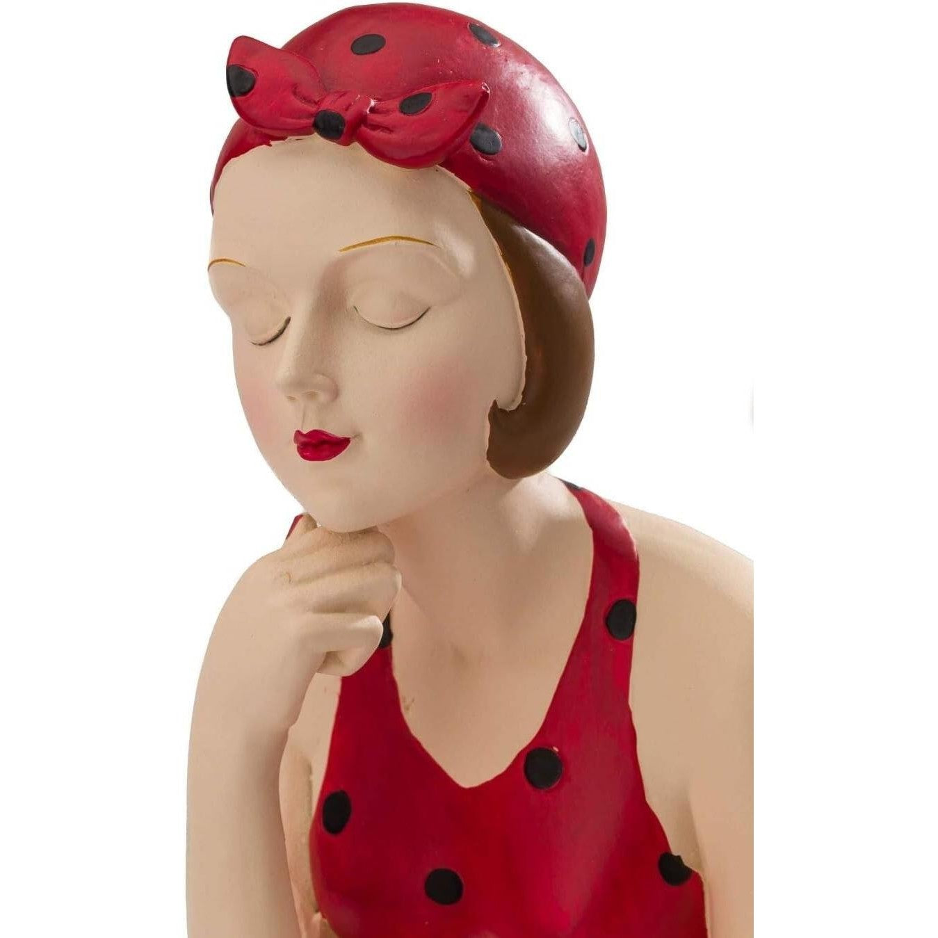 Figurine of Retro Lady in Red Swimsuit Sitting on Beach