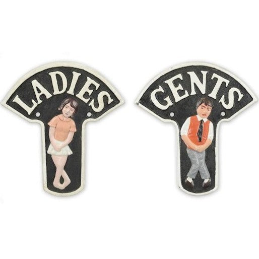 Hand-painted cast iron Ladies and Gents vintage restroom wall sign set with black background and decorative figures.