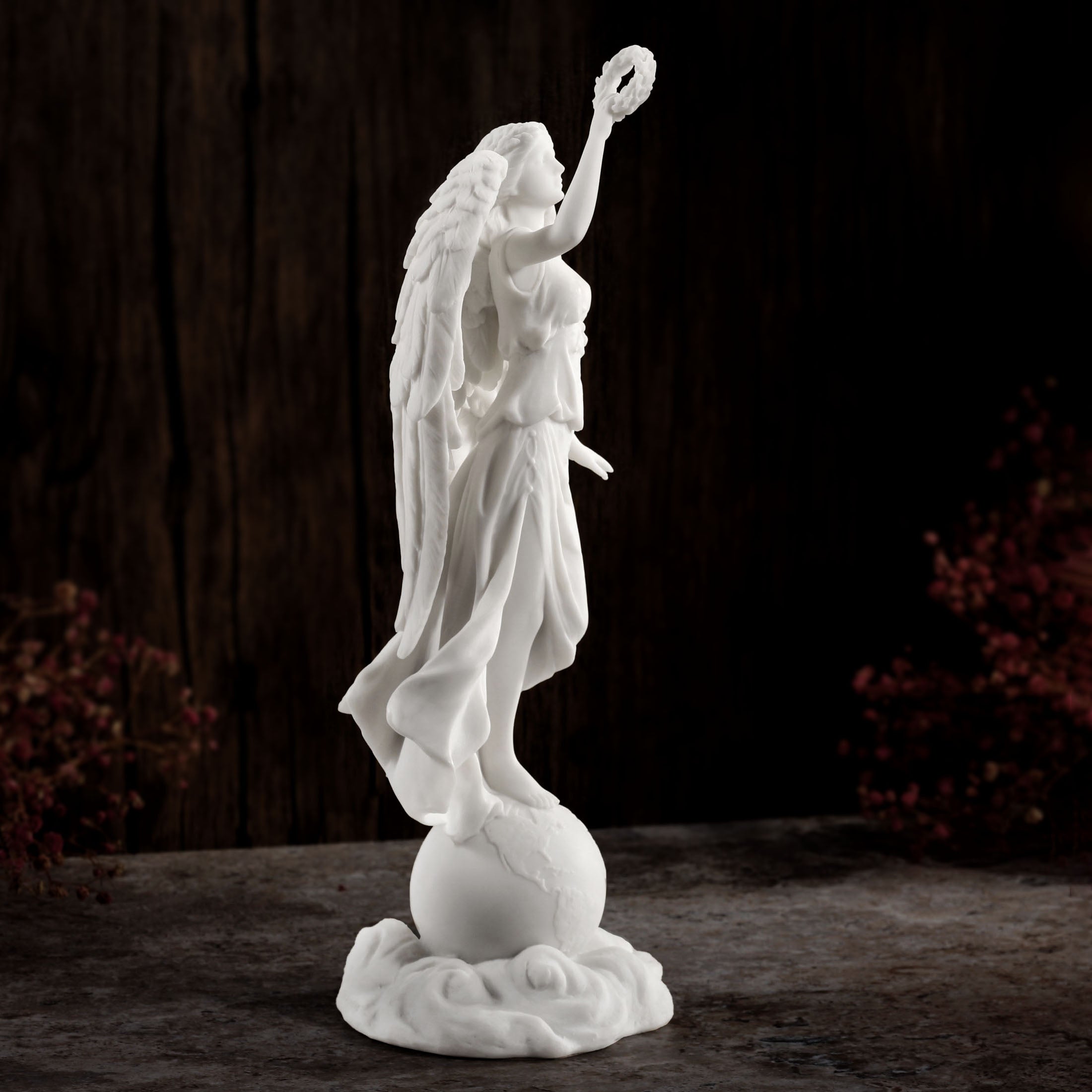 Angel Holding Wreath Standing On Earth