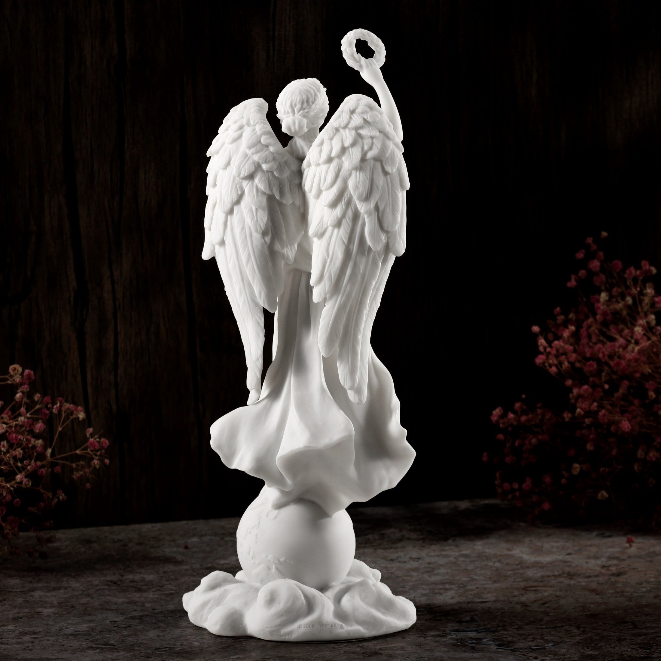 Angel Holding Wreath Standing On Earth