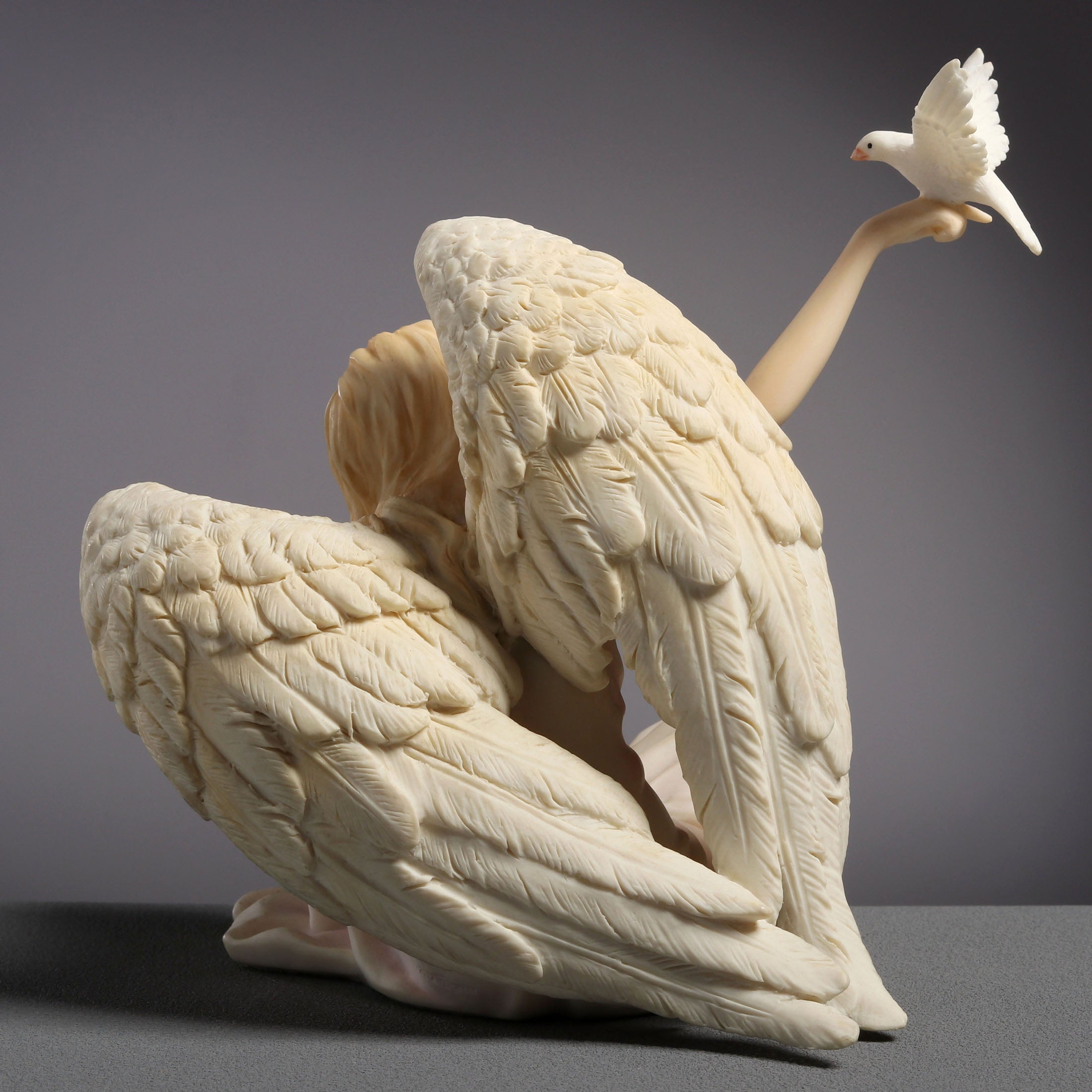 Angel Sitting With Dove On Right Hand (Light Color)