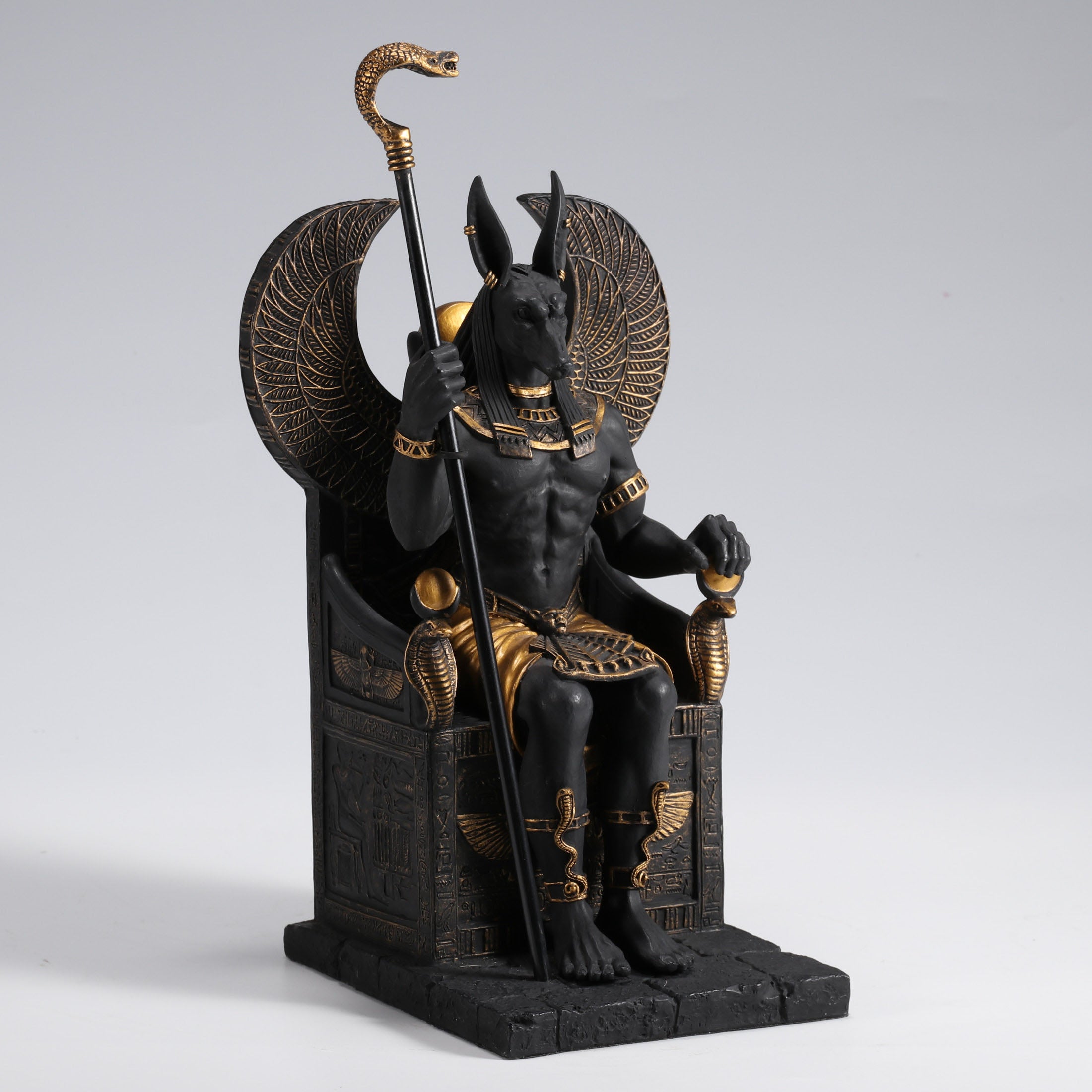Egyptian God Anubis Sitting In A Throne