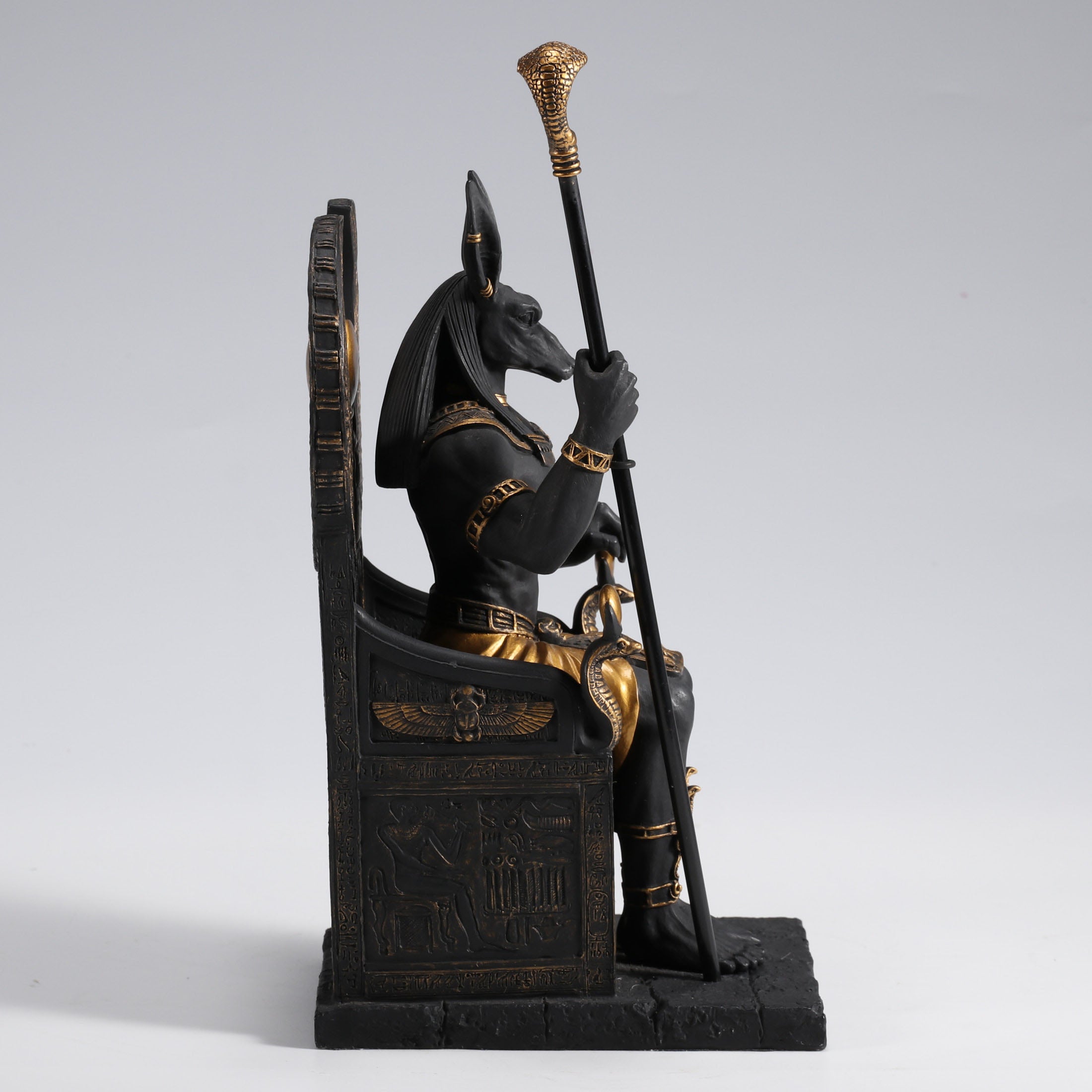 Egyptian God Anubis Sitting In A Throne