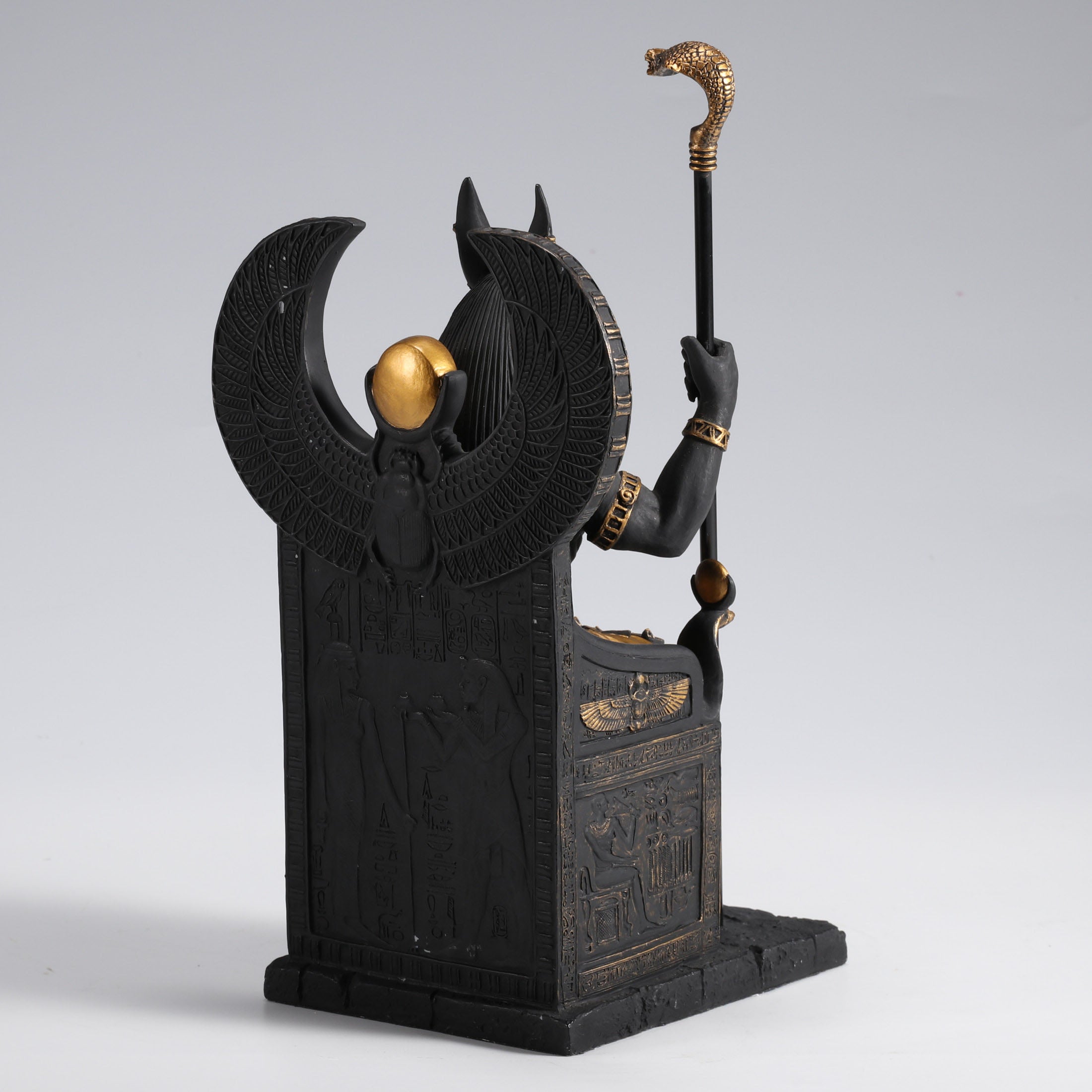 Egyptian God Anubis Sitting In A Throne