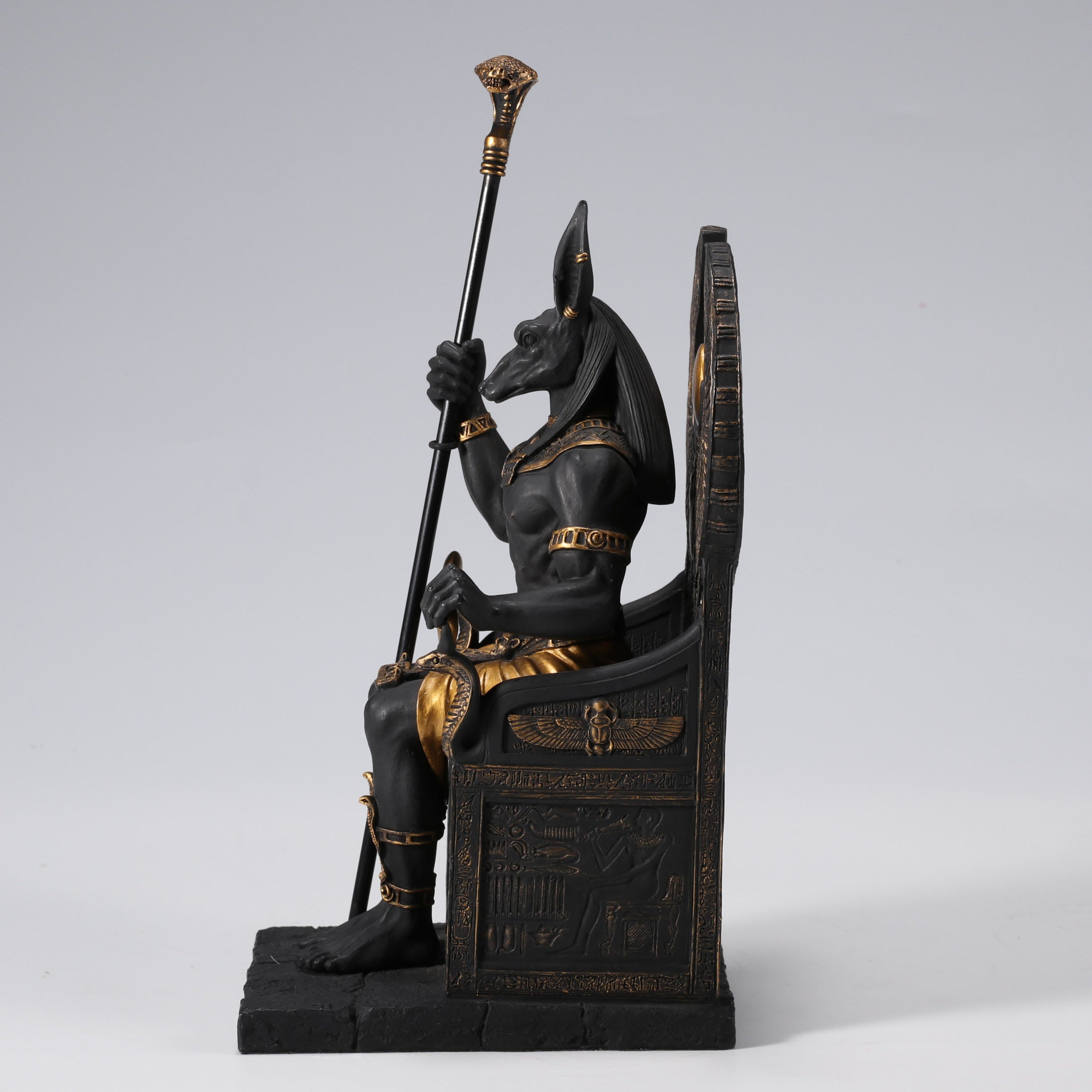 Egyptian God Anubis Sitting In A Throne