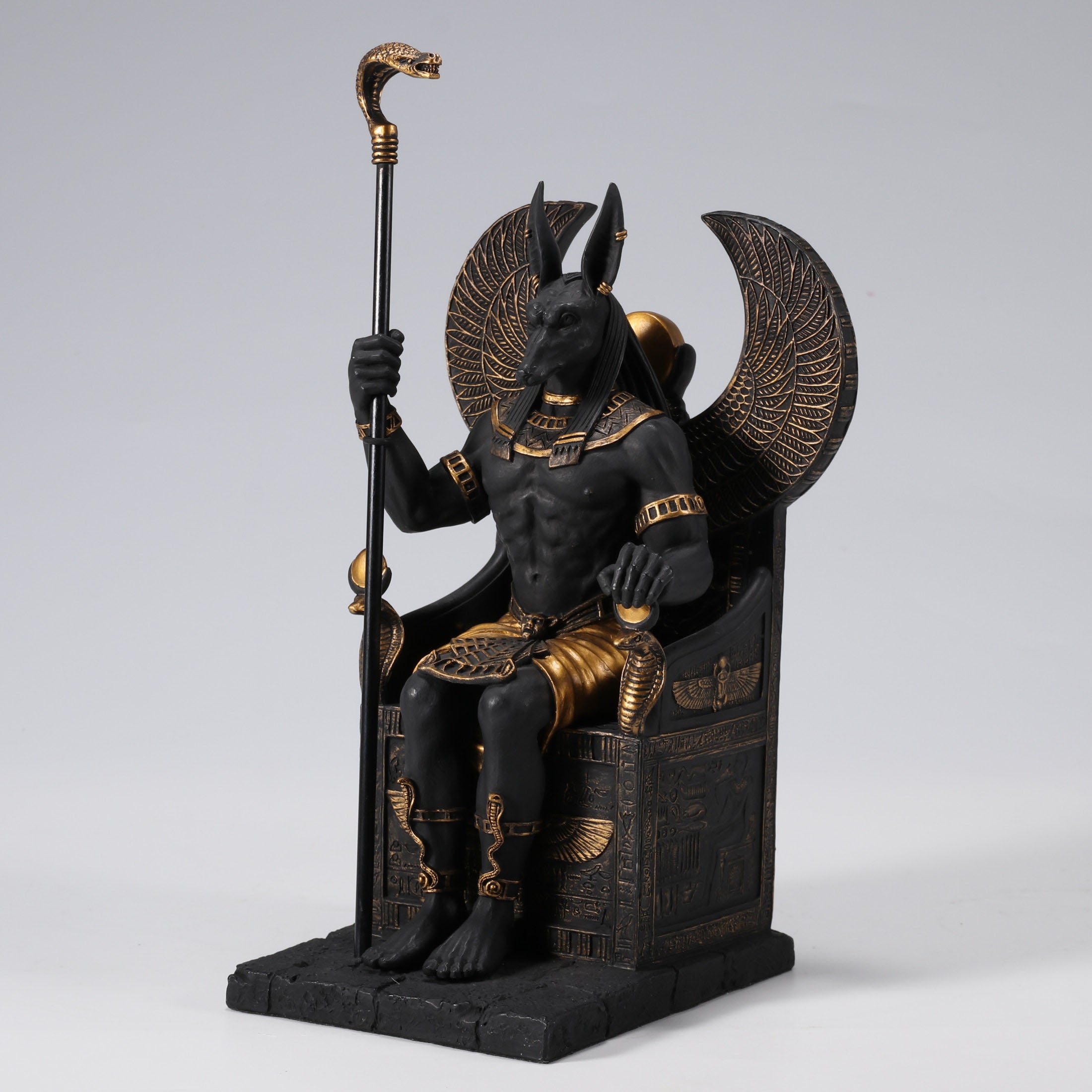 Egyptian God Anubis Sitting In A Throne