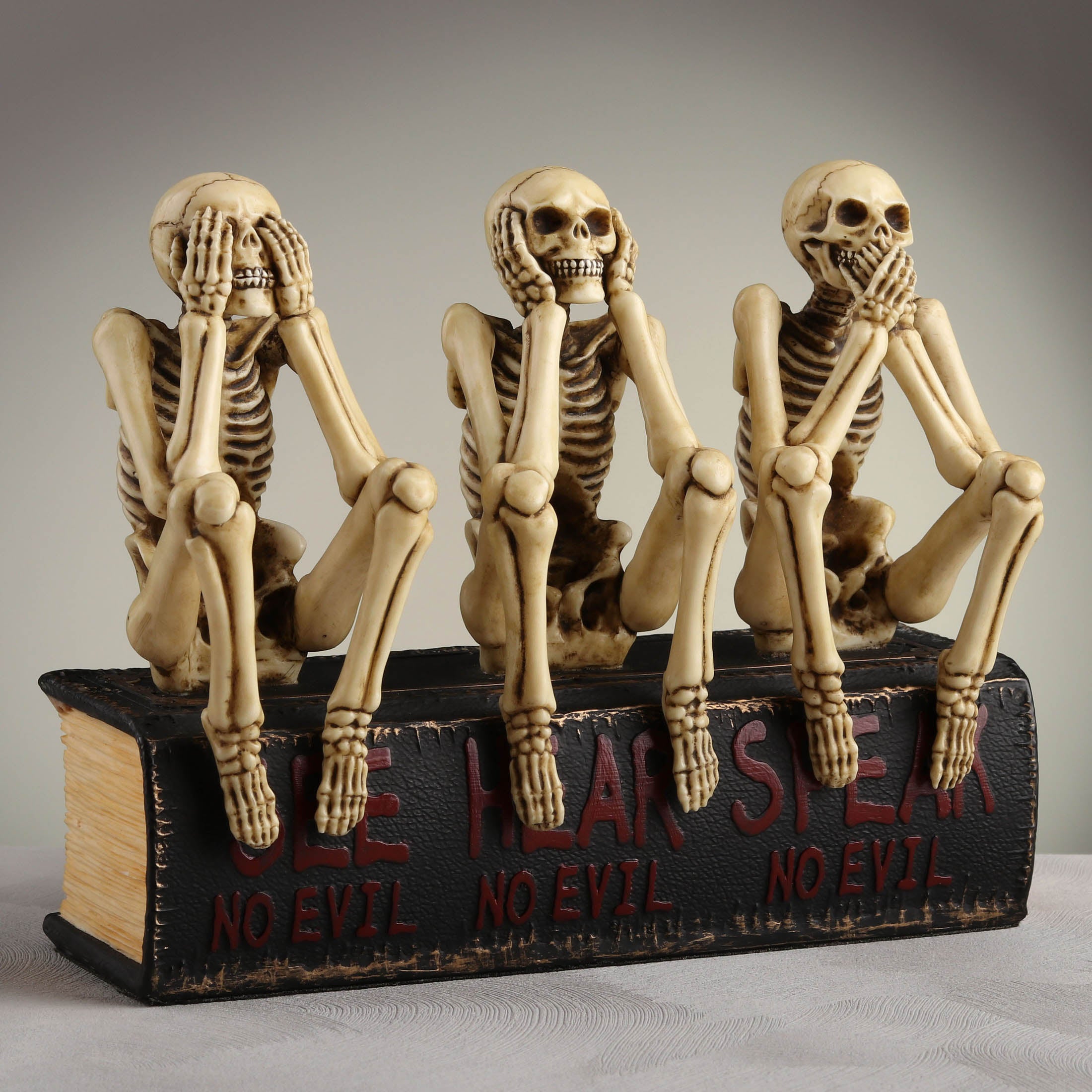 See No Evil Hear No Evil Speak No Evil Skeletons Sitting On Book