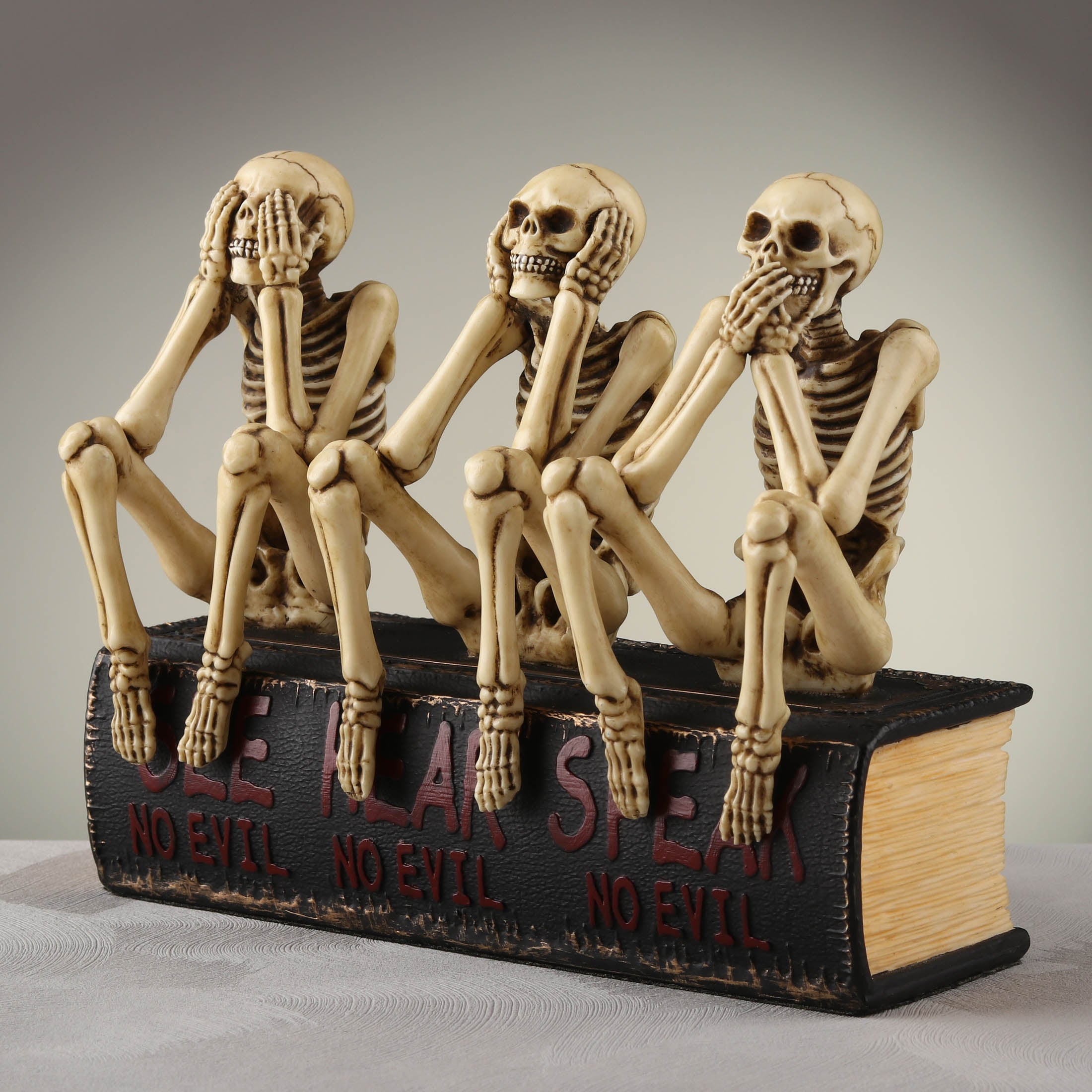 See No Evil Hear No Evil Speak No Evil Skeletons Sitting On Book