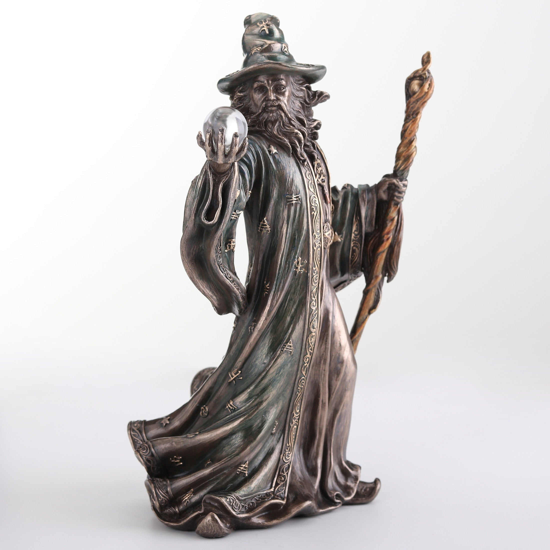 Wizard Holding Crystal Ball And Staff
