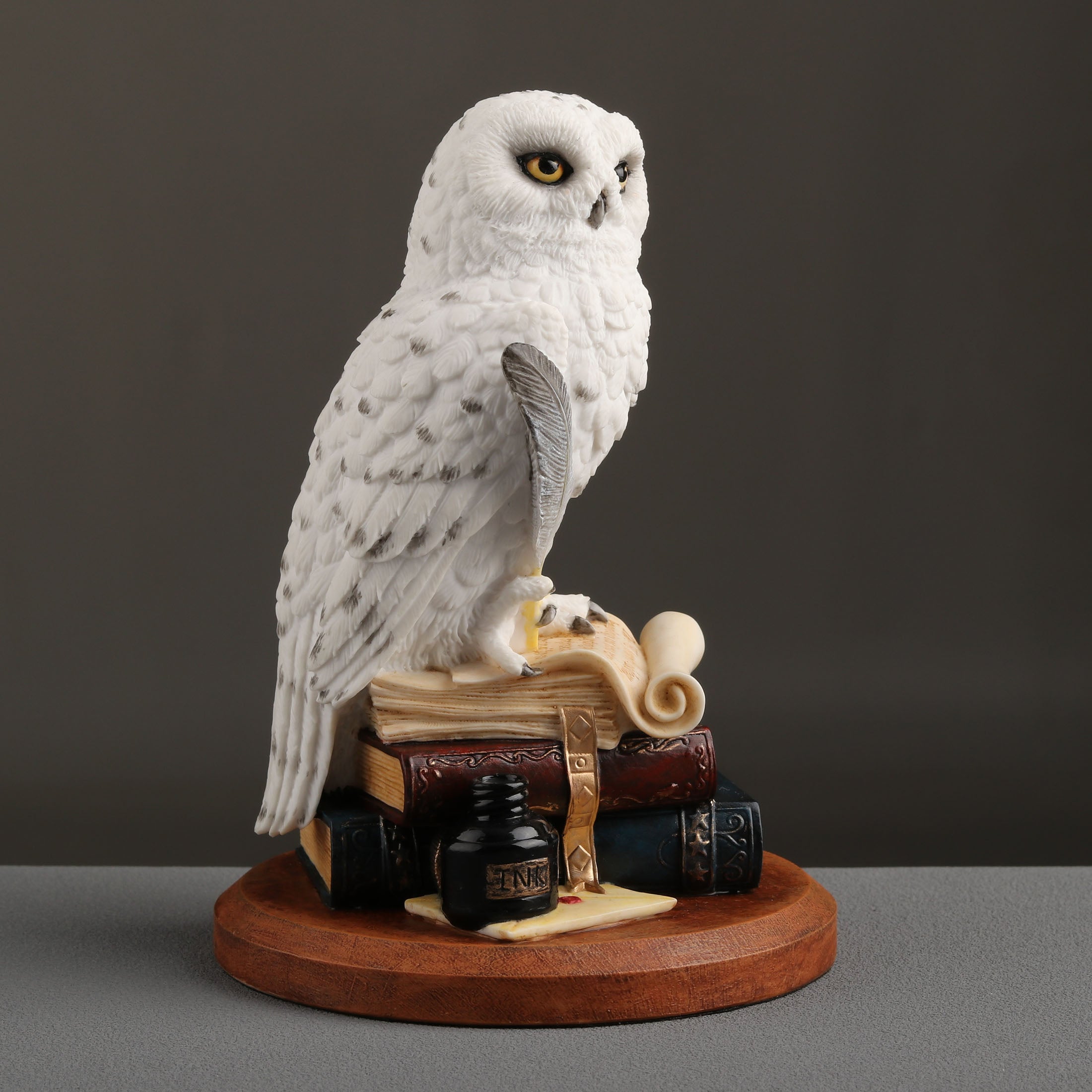 Snowy Owl Scripting On Top Of Stack Of Books