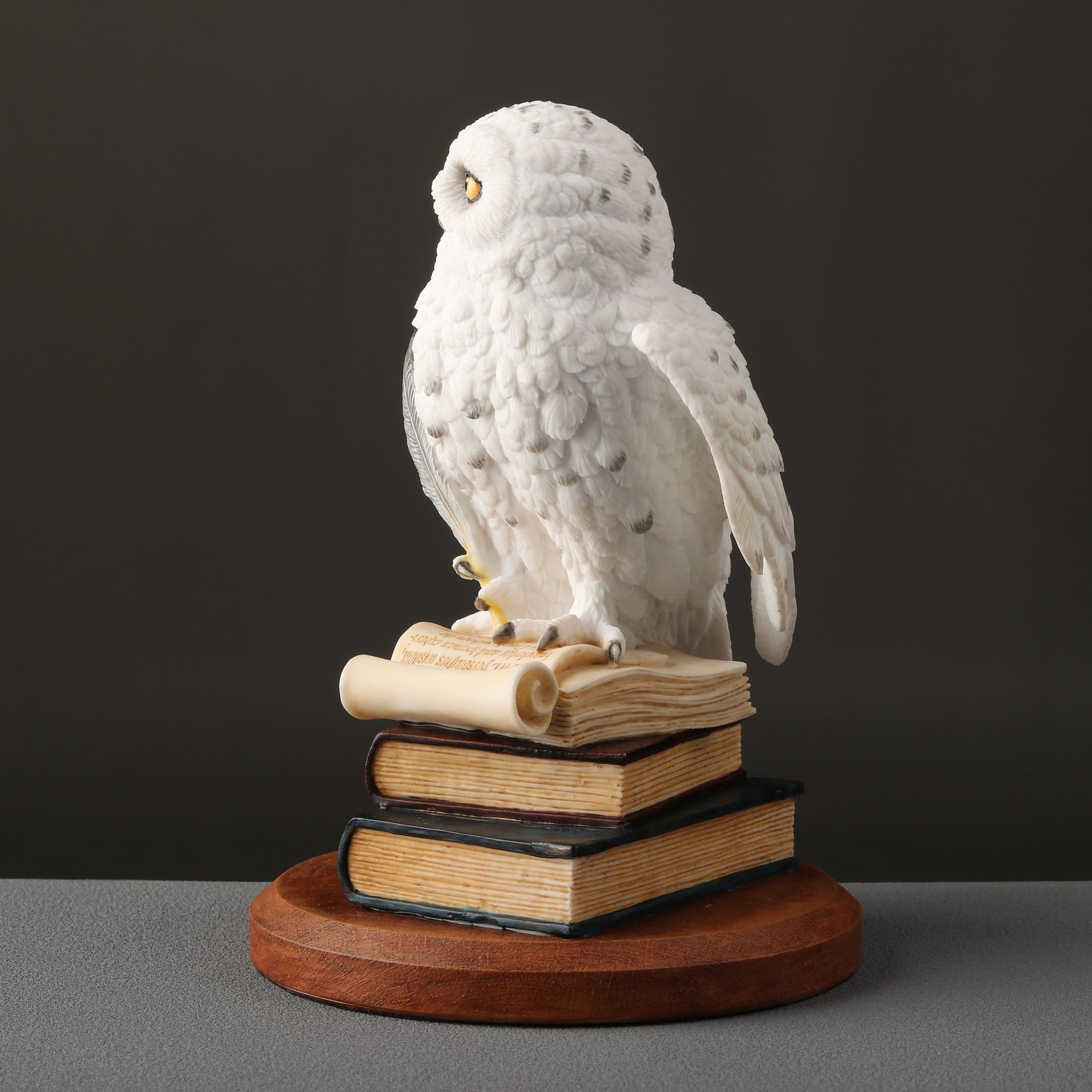 Snowy Owl Scripting On Top Of Stack Of Books