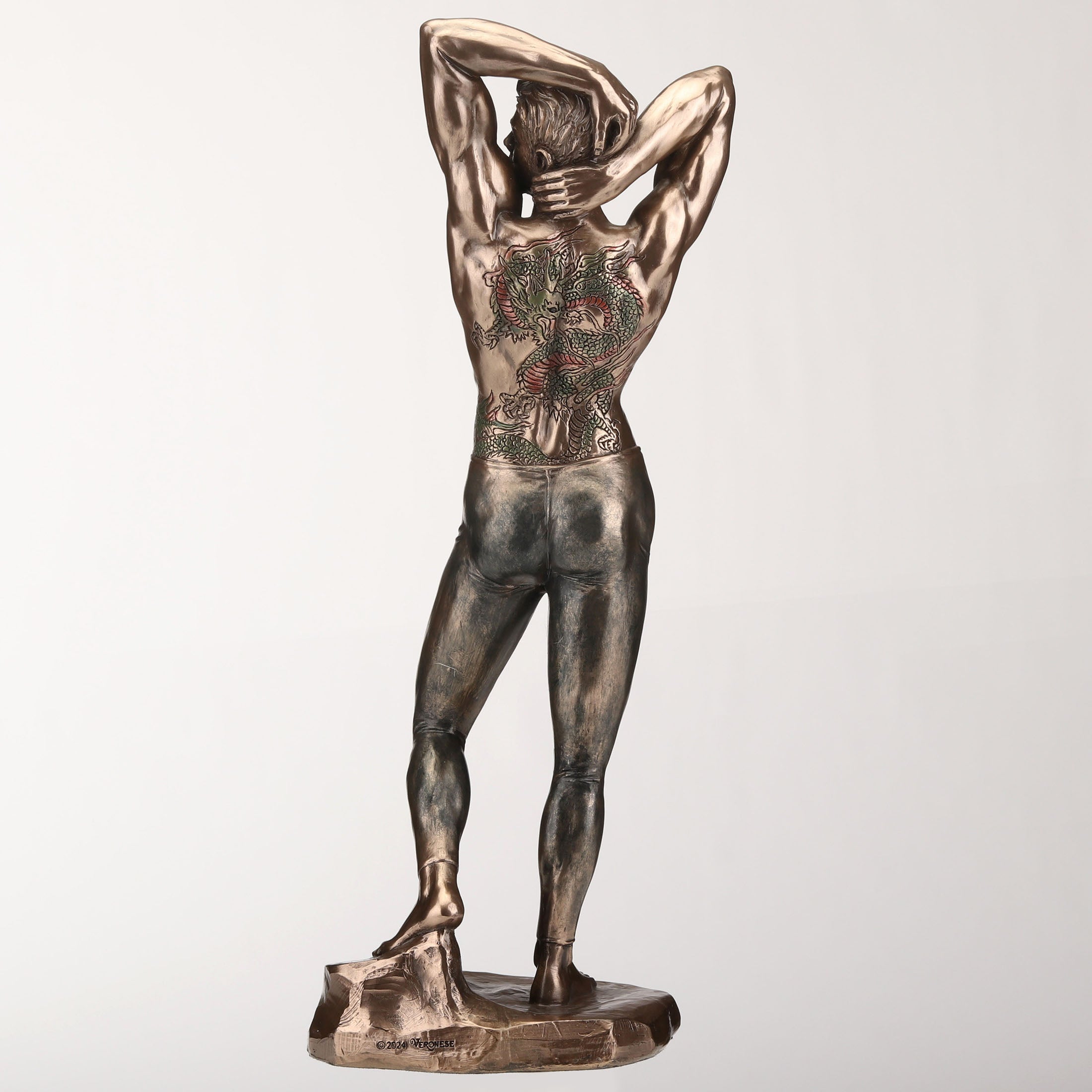 Tattooed Male In Tights Stretching Pinup Pose