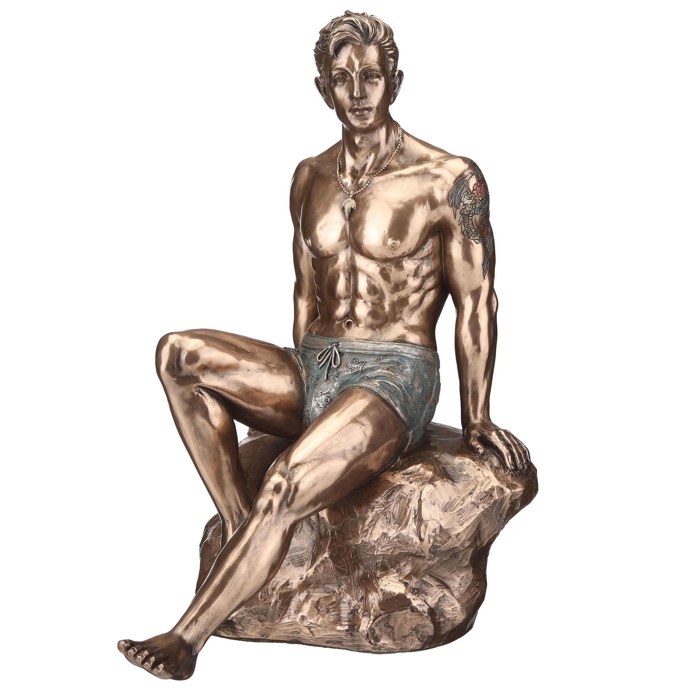 Tattooed Male Sitting On Rock Beach Pinup