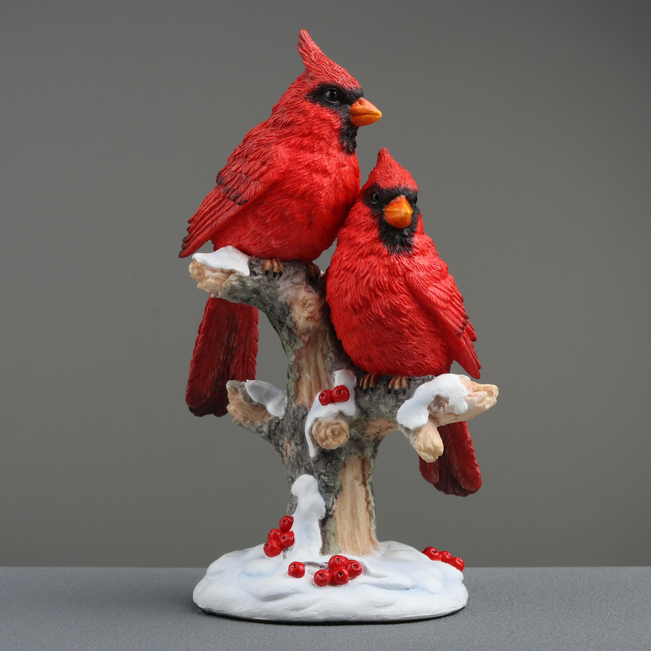 Twin Cardinal Perching On Snow Covered Branch