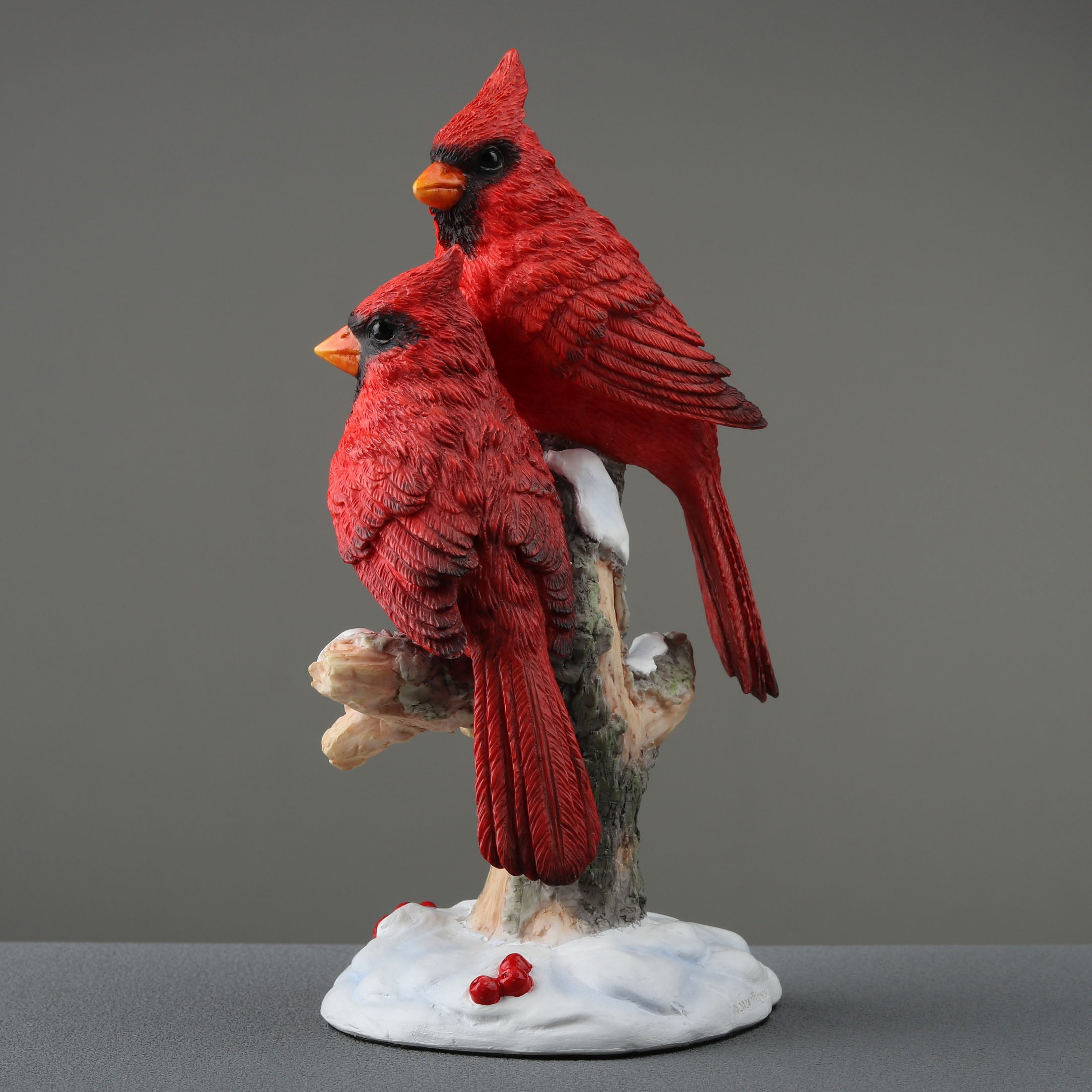 Twin Cardinal Perching On Snow Covered Branch