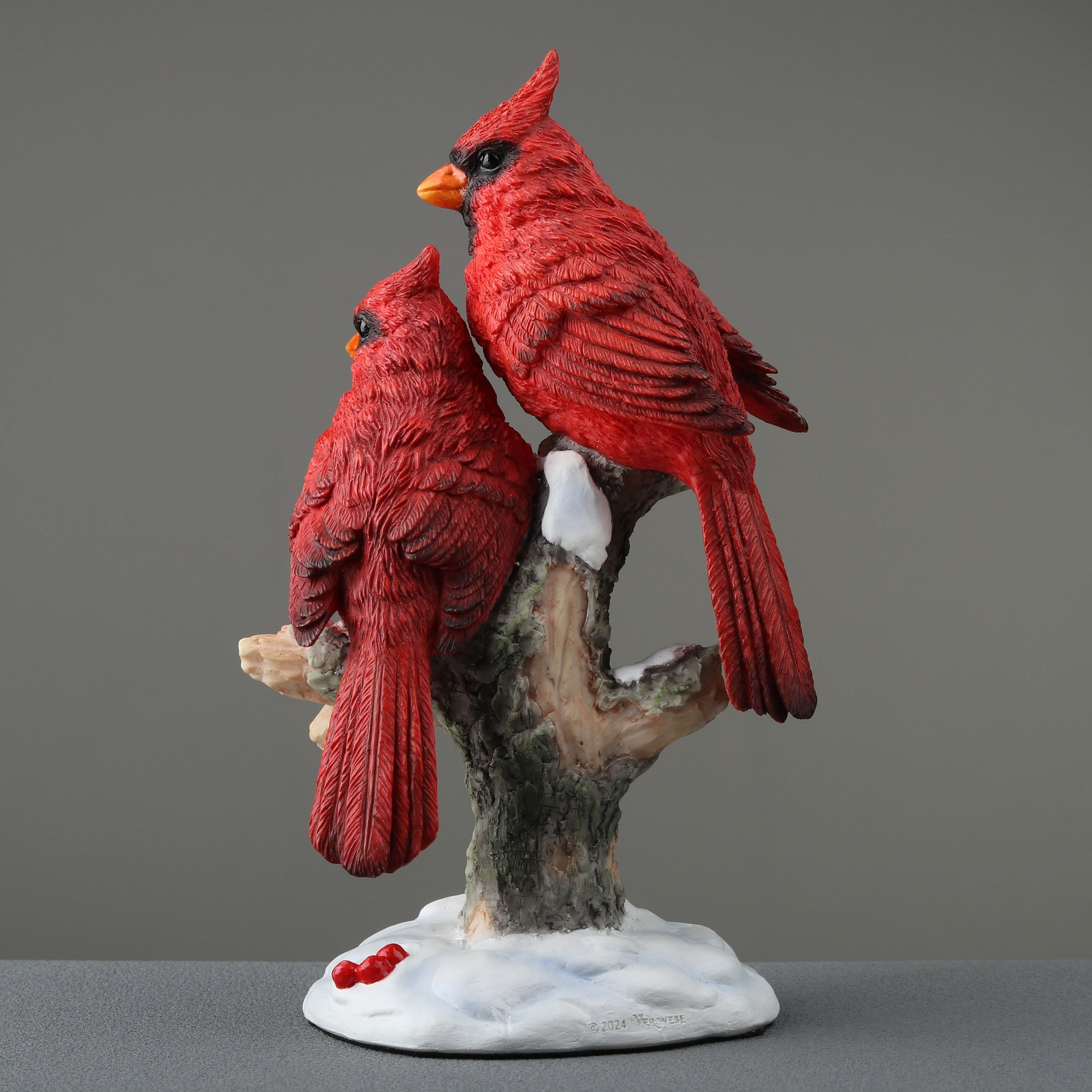 Twin Cardinal Perching On Snow Covered Branch