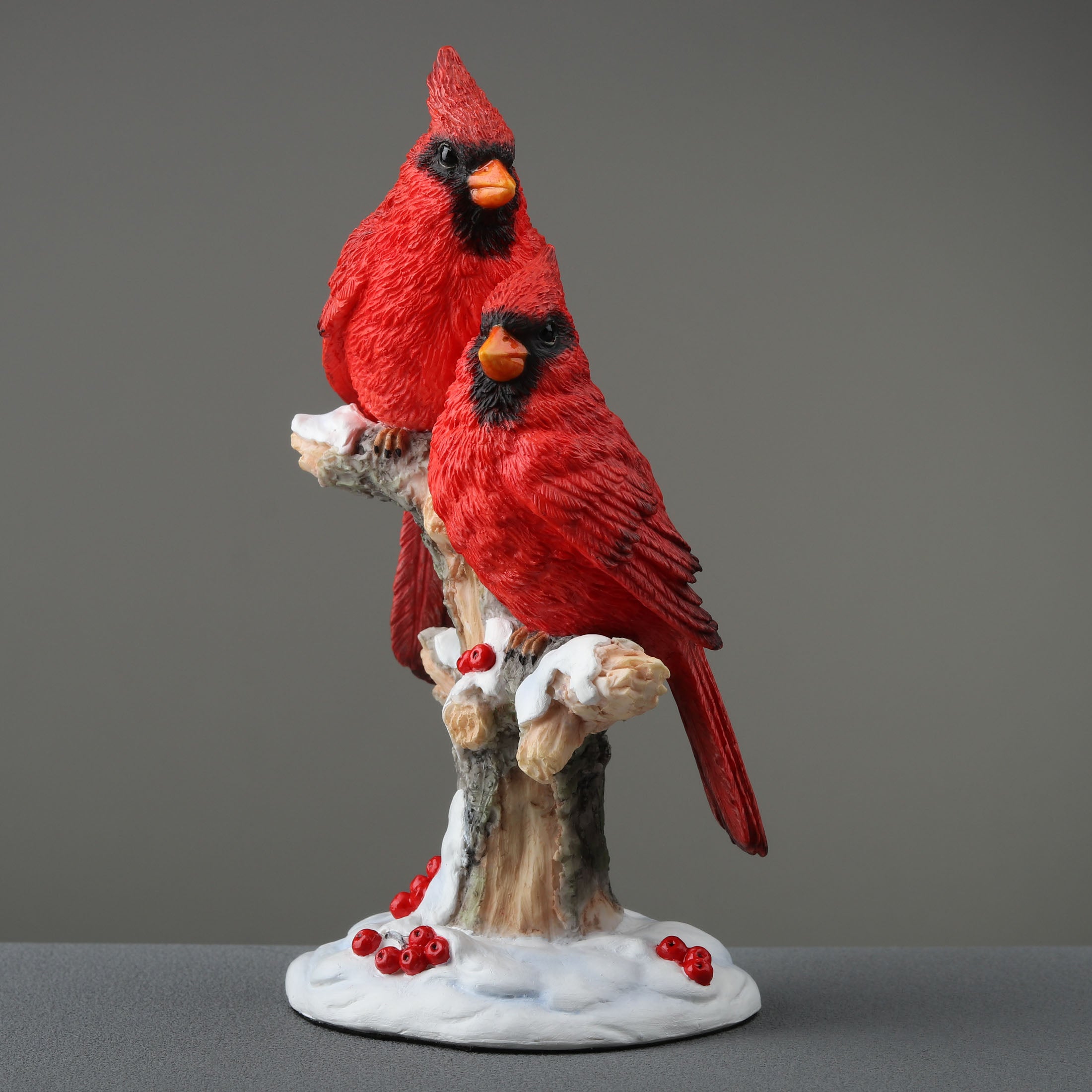 Twin Cardinal Perching On Snow Covered Branch
