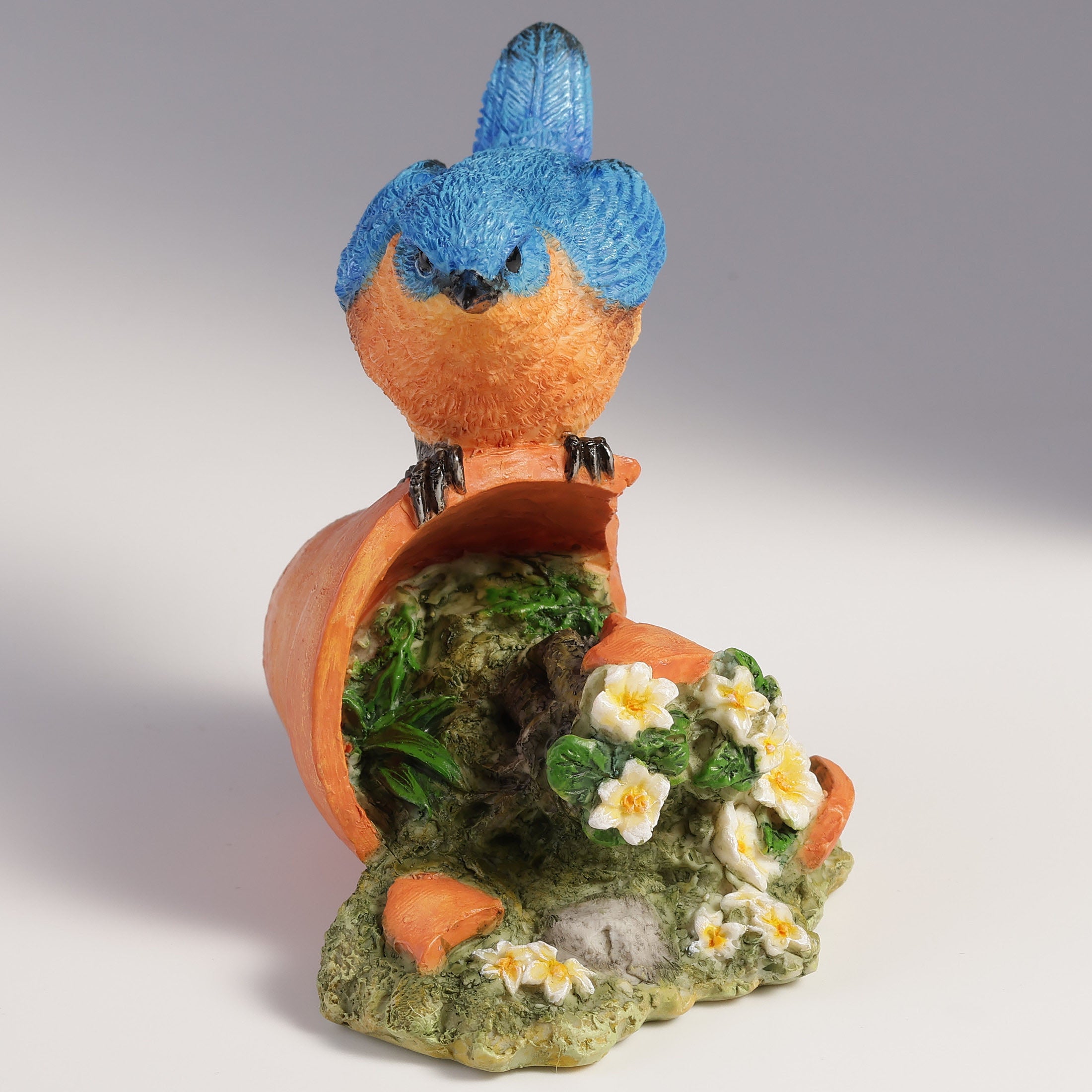 Bluebird Perching On Tipped Over Flower Pot