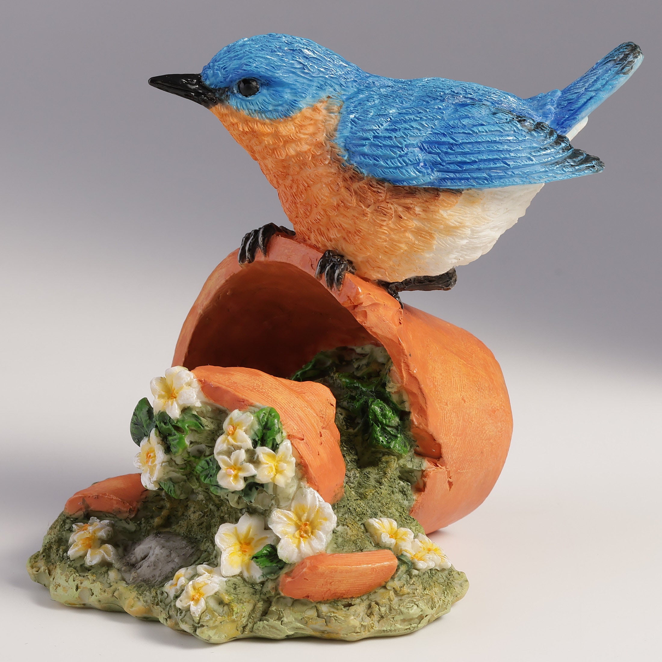 Bluebird Perching On Tipped Over Flower Pot