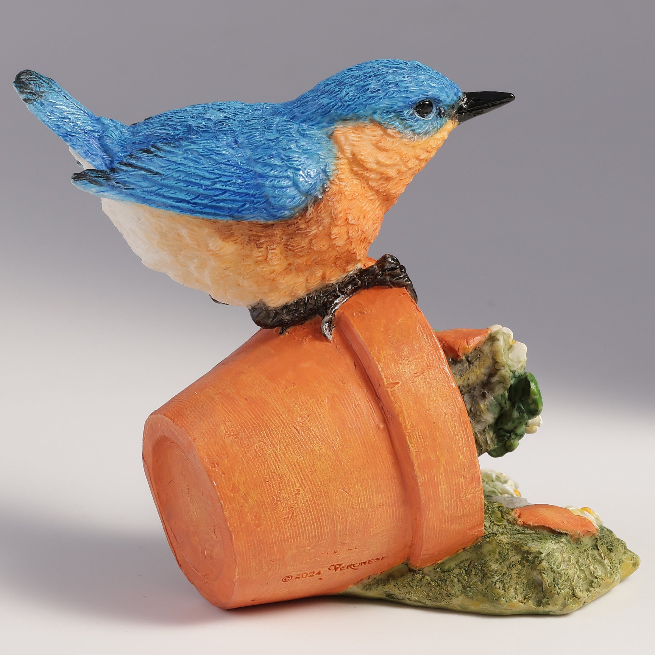 Bluebird Perching On Tipped Over Flower Pot