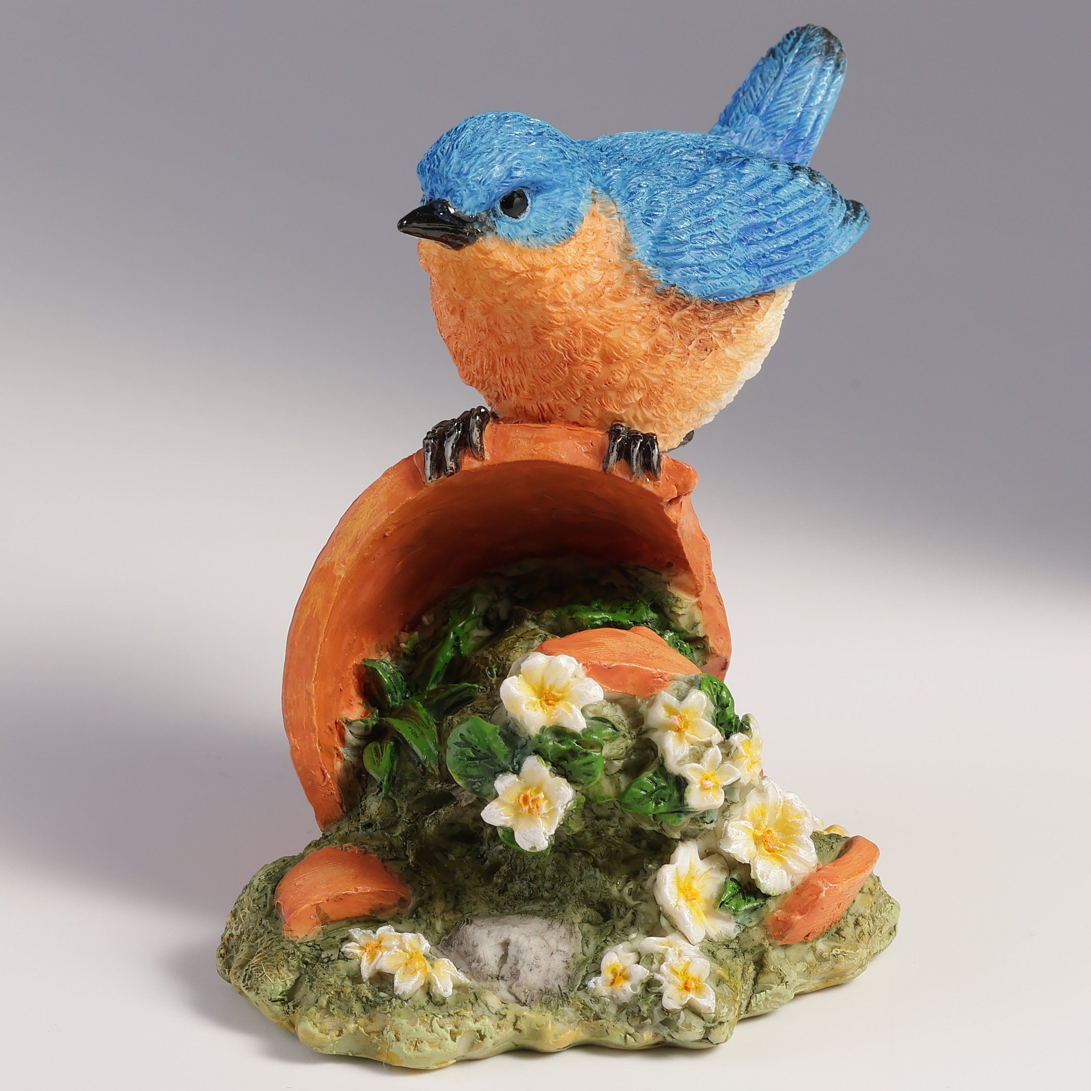 Bluebird Perching On Tipped Over Flower Pot