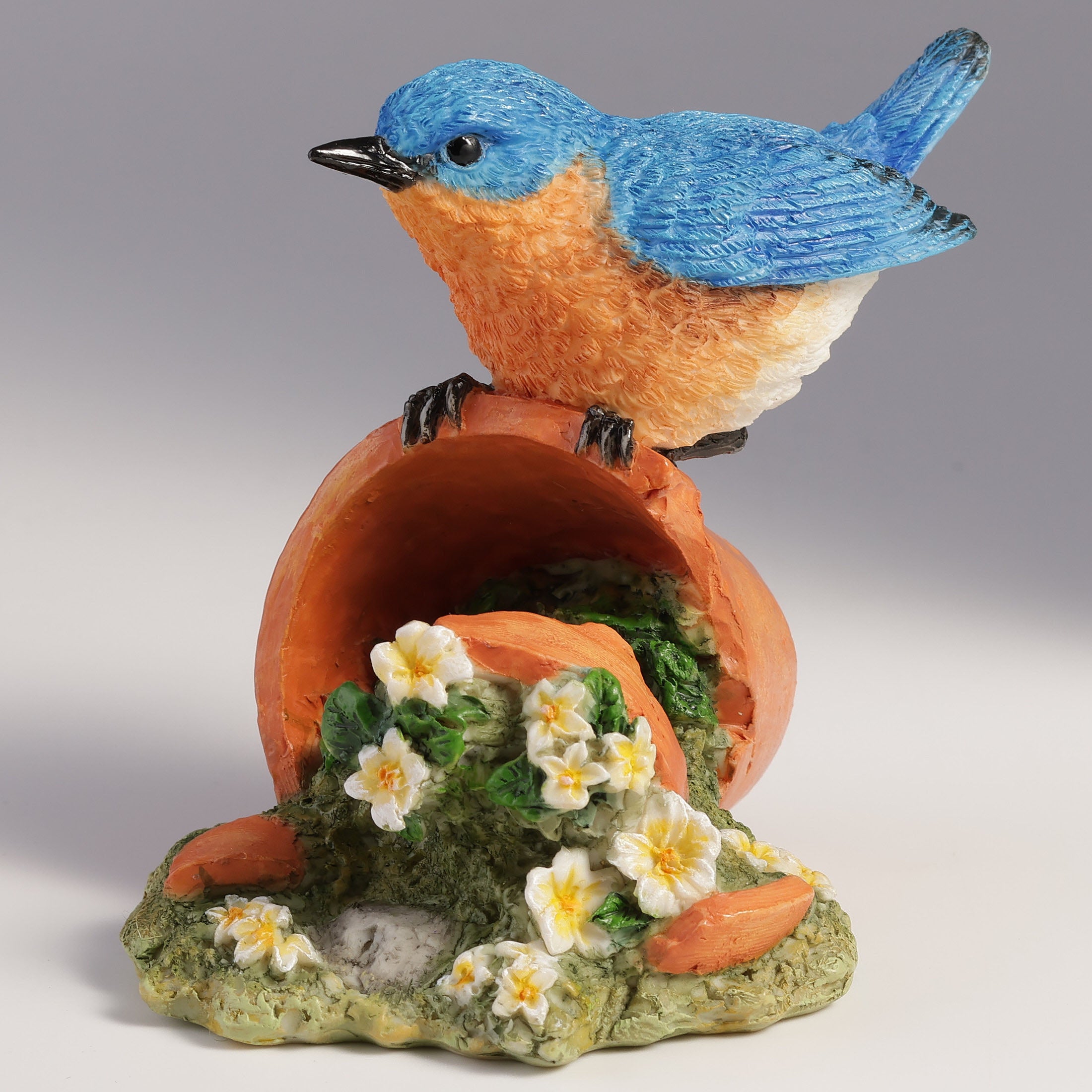 Bluebird Perching On Tipped Over Flower Pot