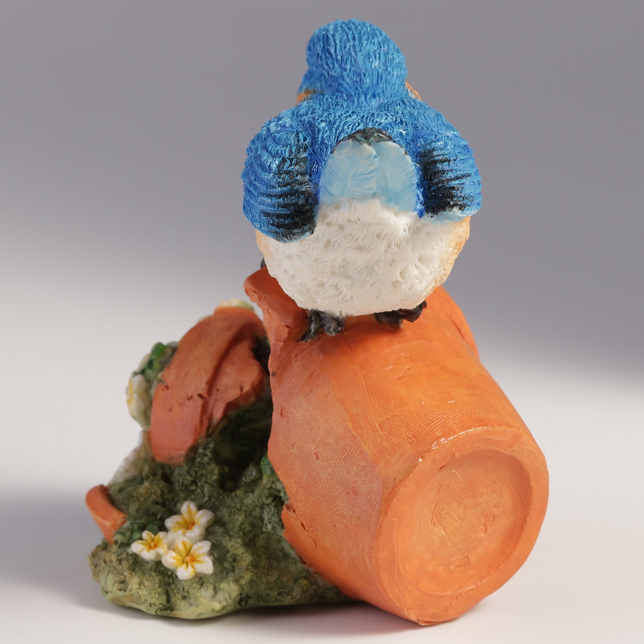 Bluebird Perching On Tipped Over Flower Pot