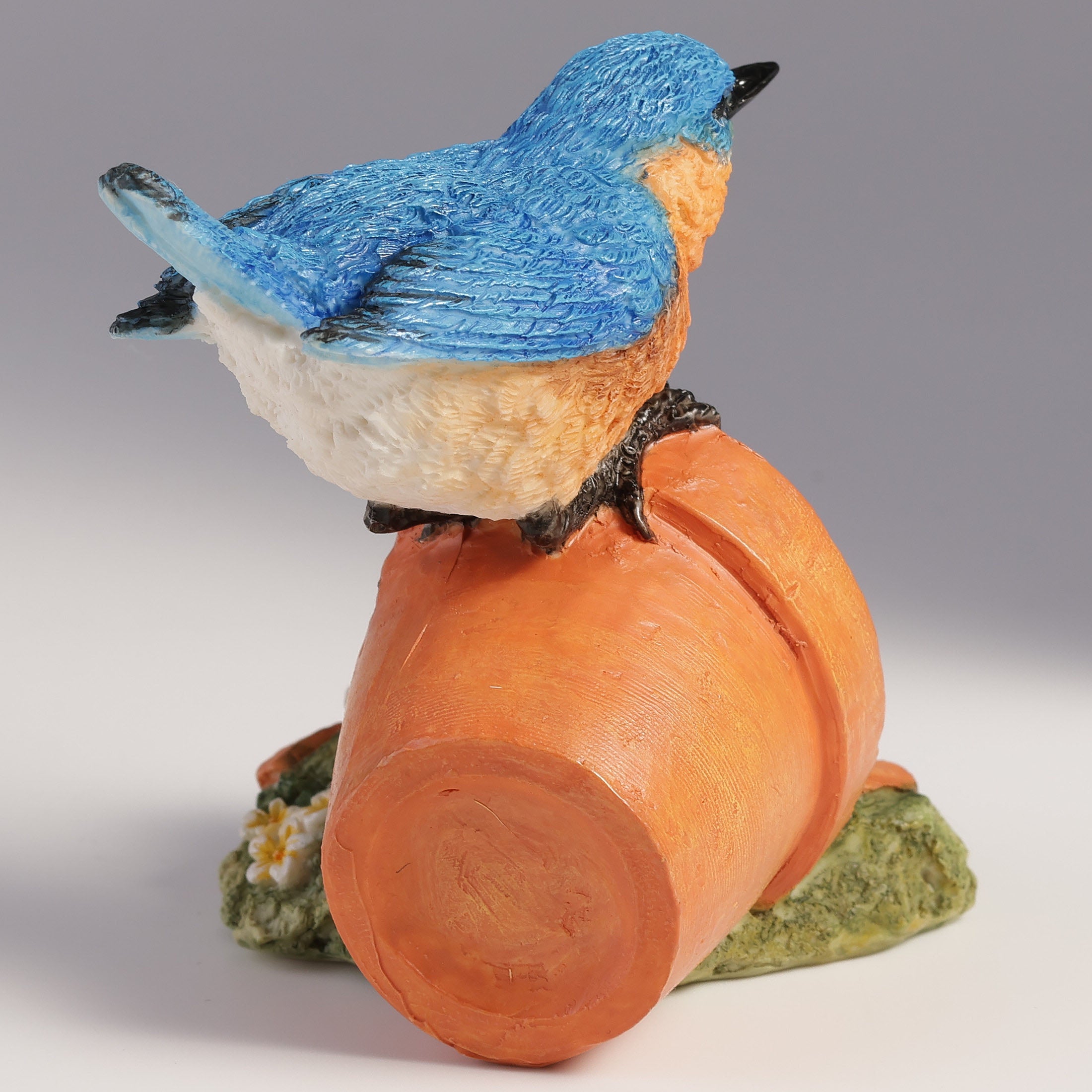 Bluebird Perching On Tipped Over Flower Pot