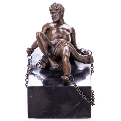 Mythological bronze figure of the Titan Prometheus chained to the rock