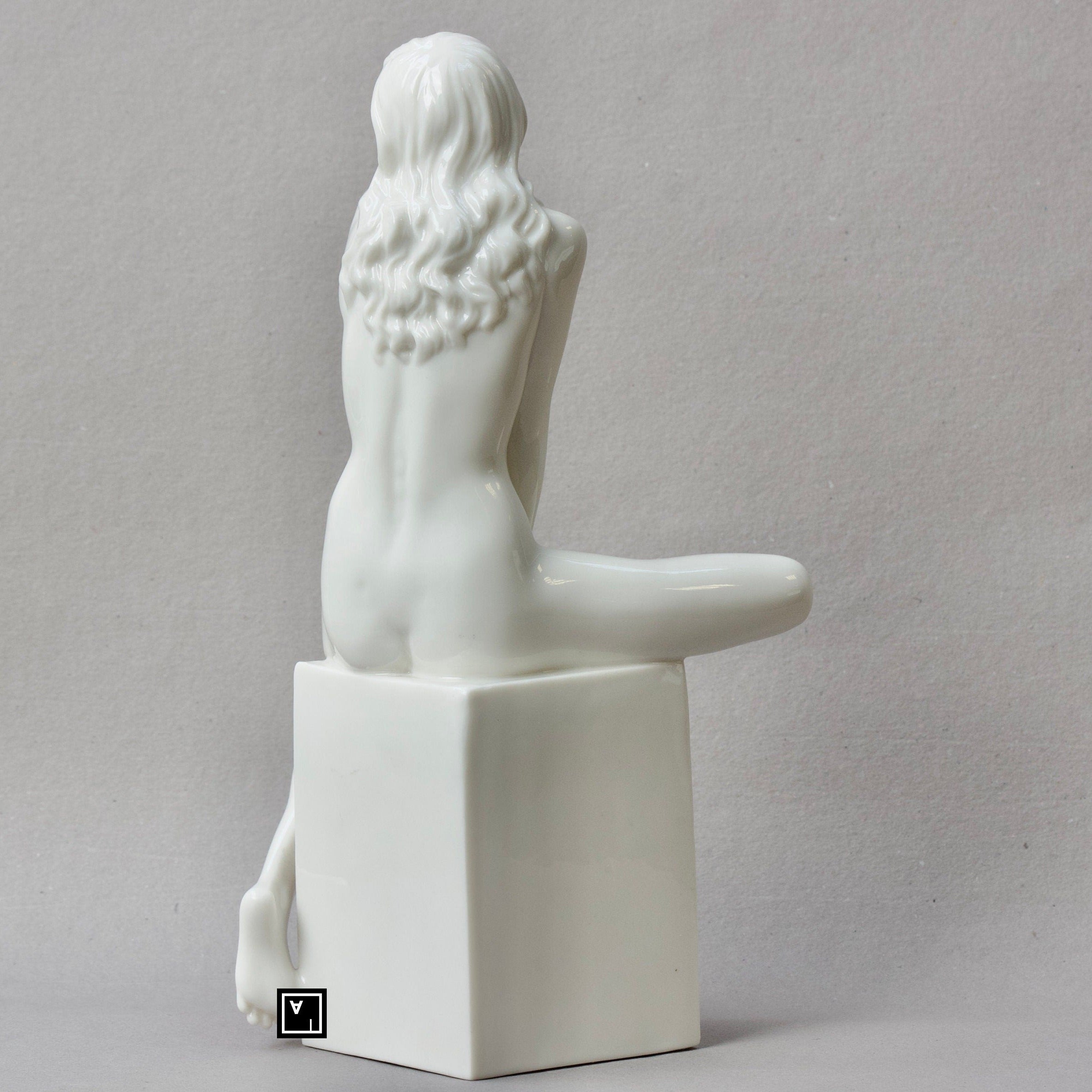Nude Woman Standing on Bust Sculpture. Female nude Statue