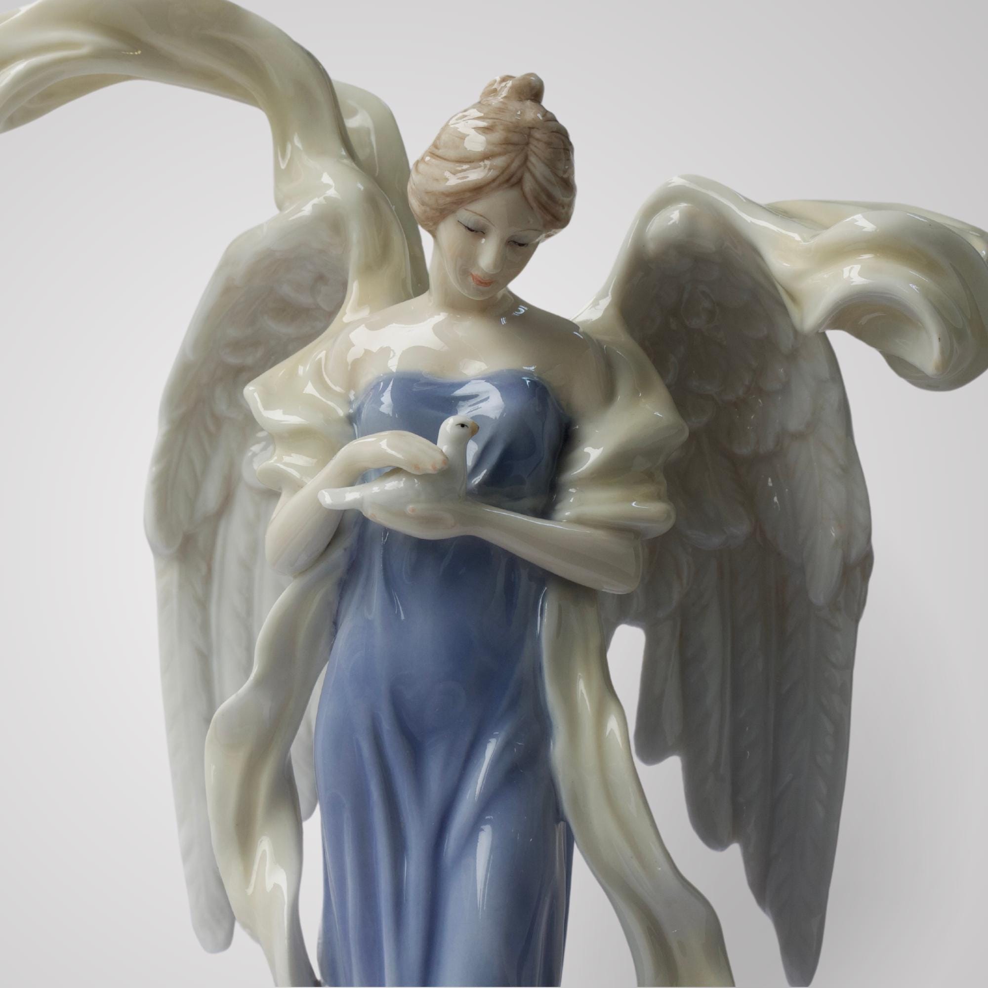 9.75 Inch Glazed Porcelain Open Winged Angel Figurine Holding Dove